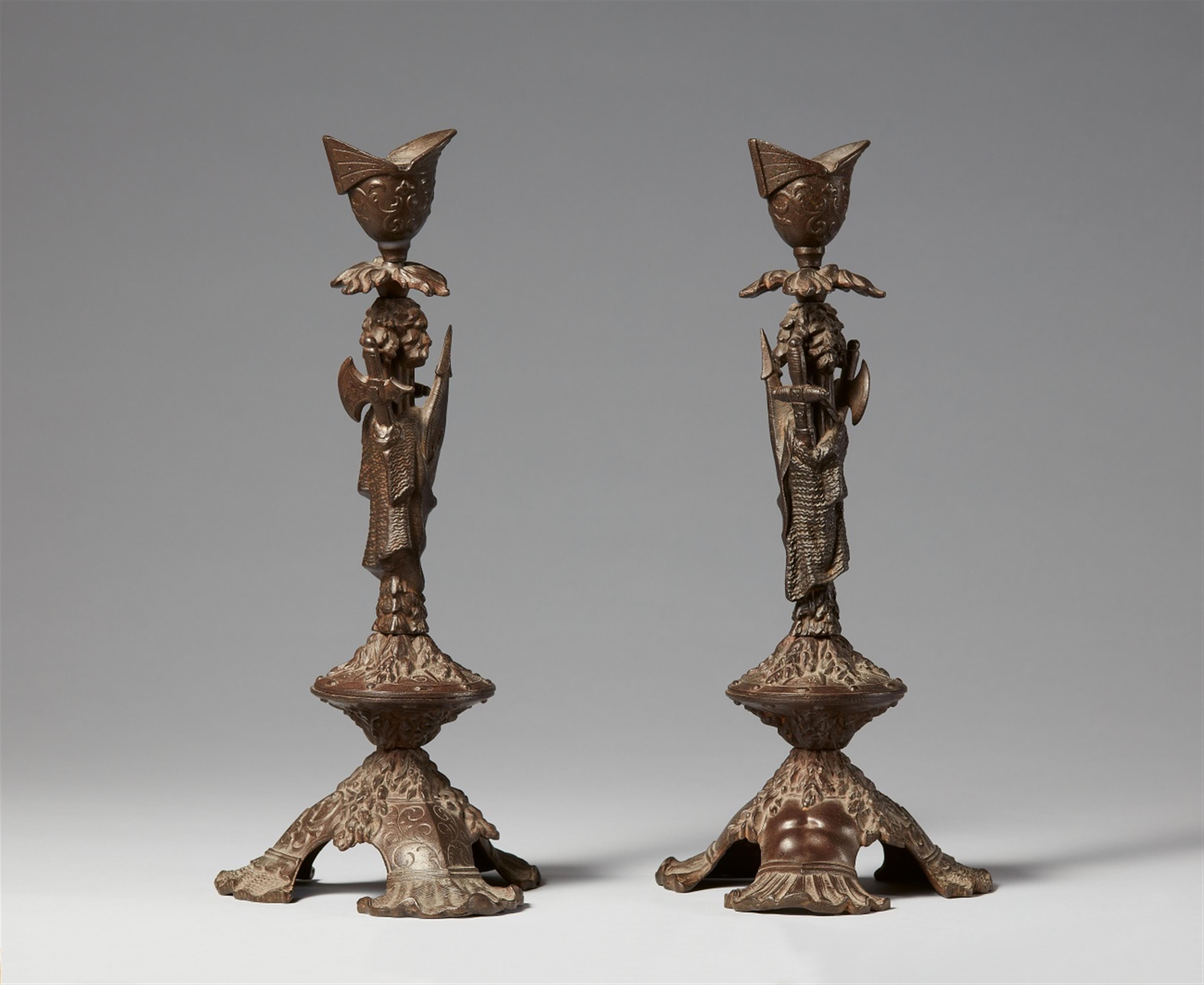 A pair of cast iron trophy candlesticks - image-1