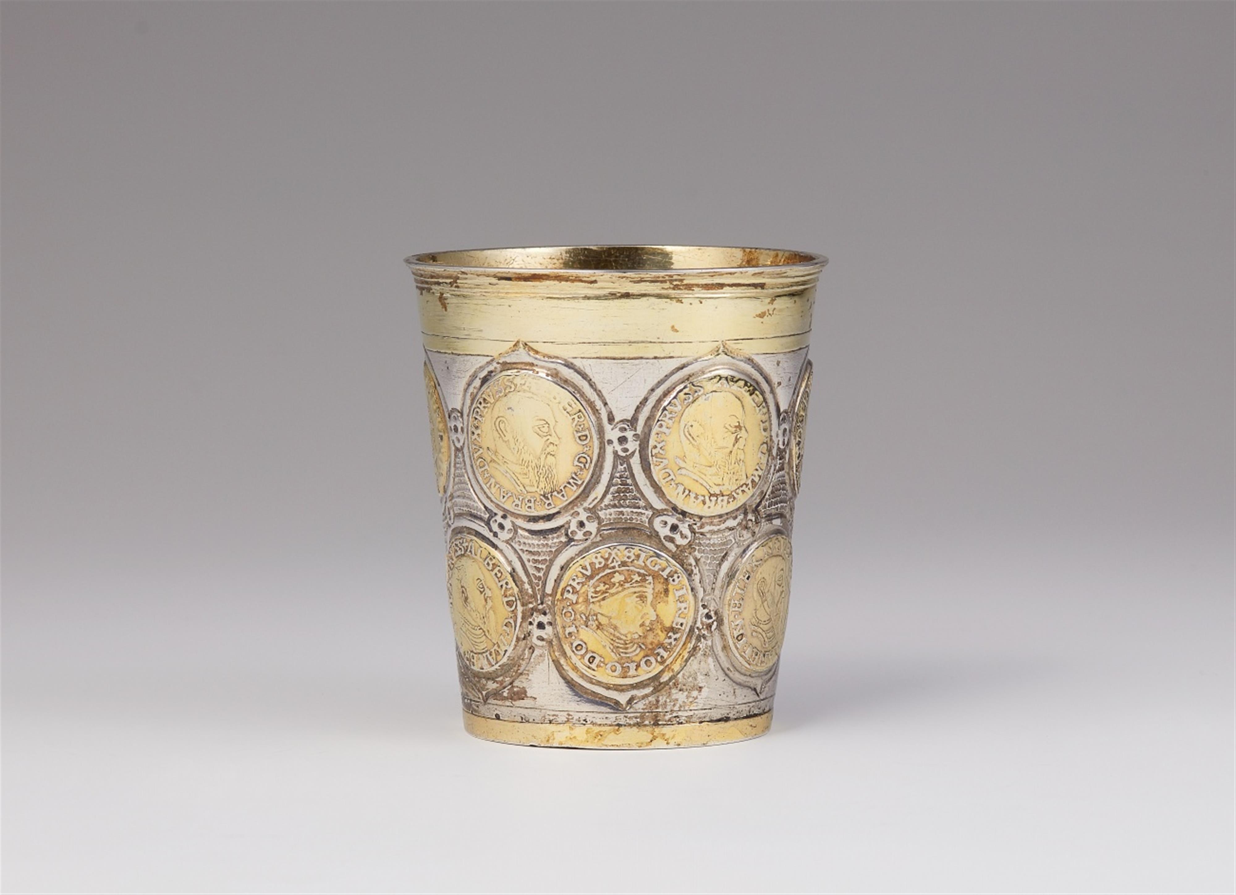 An early Berlin parcel-gilt silver coin-set beaker - image-1