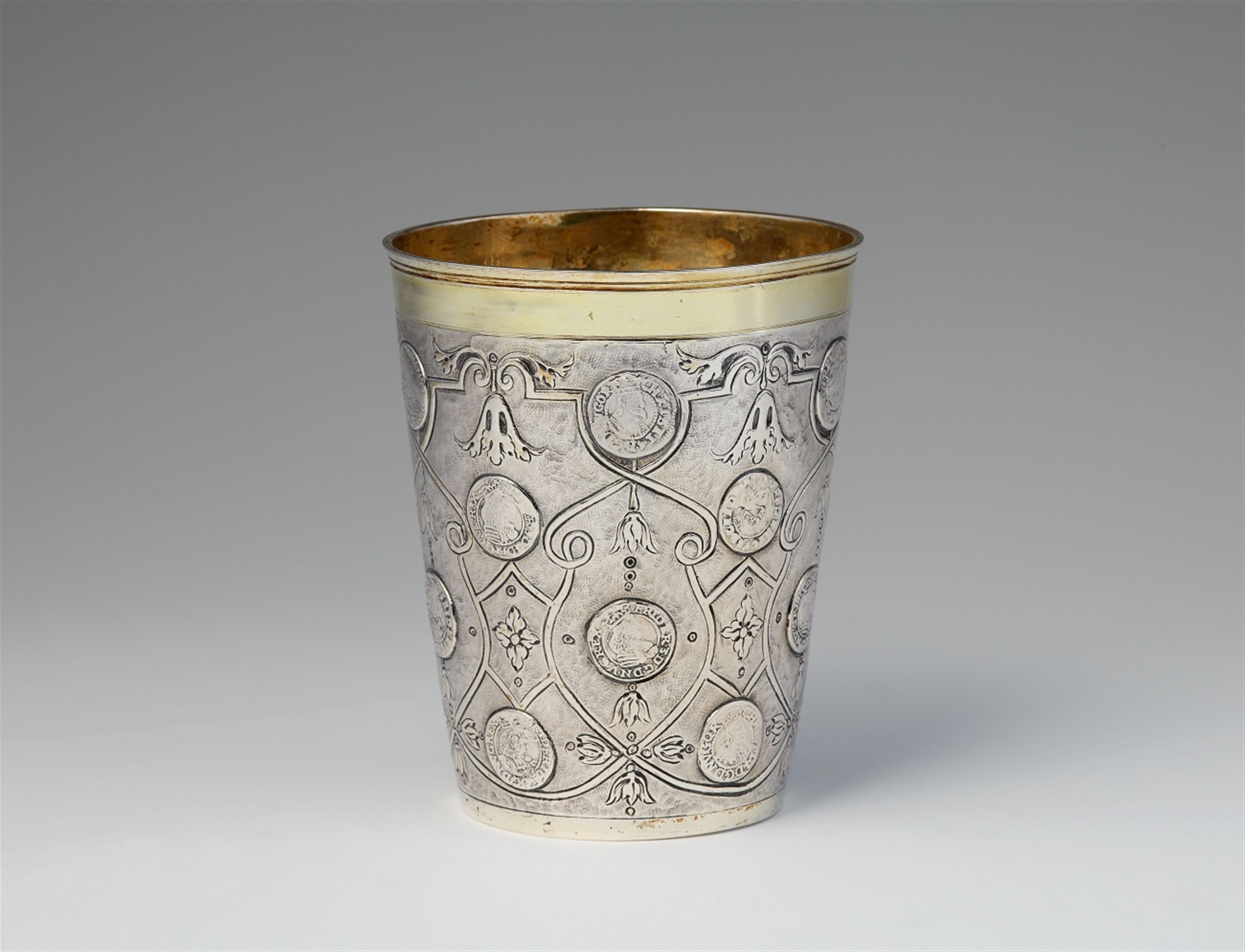 A parcel gilt silver coin set beaker - image-1