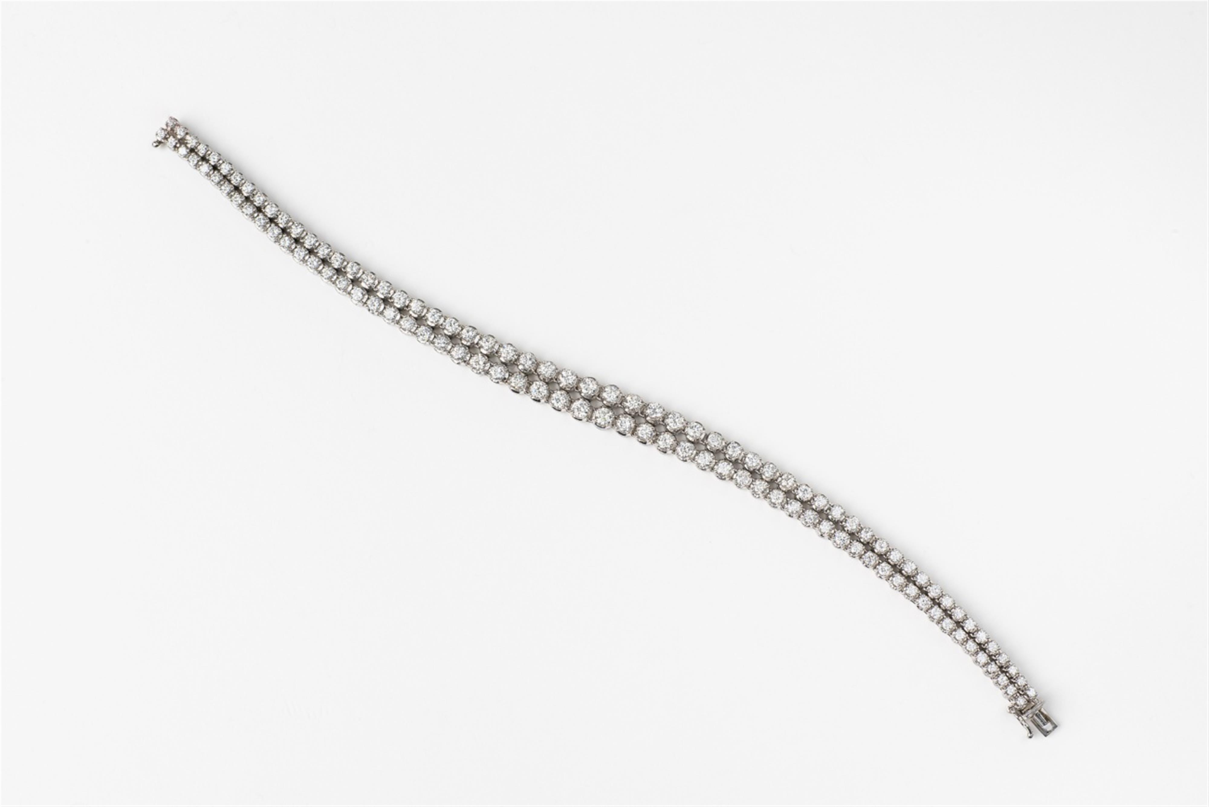 An 18k white gold and diamond bracelet - image-1