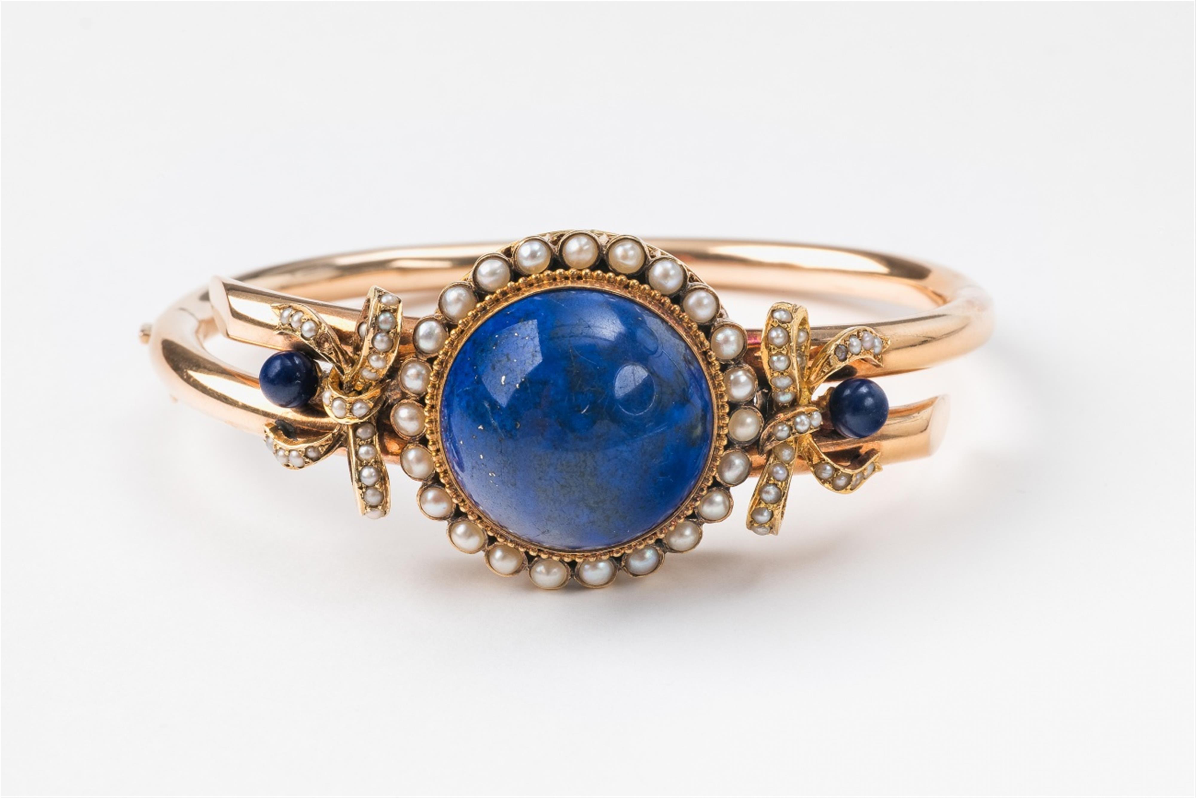 A 14k gold and lapis lazuli bangle - image-1