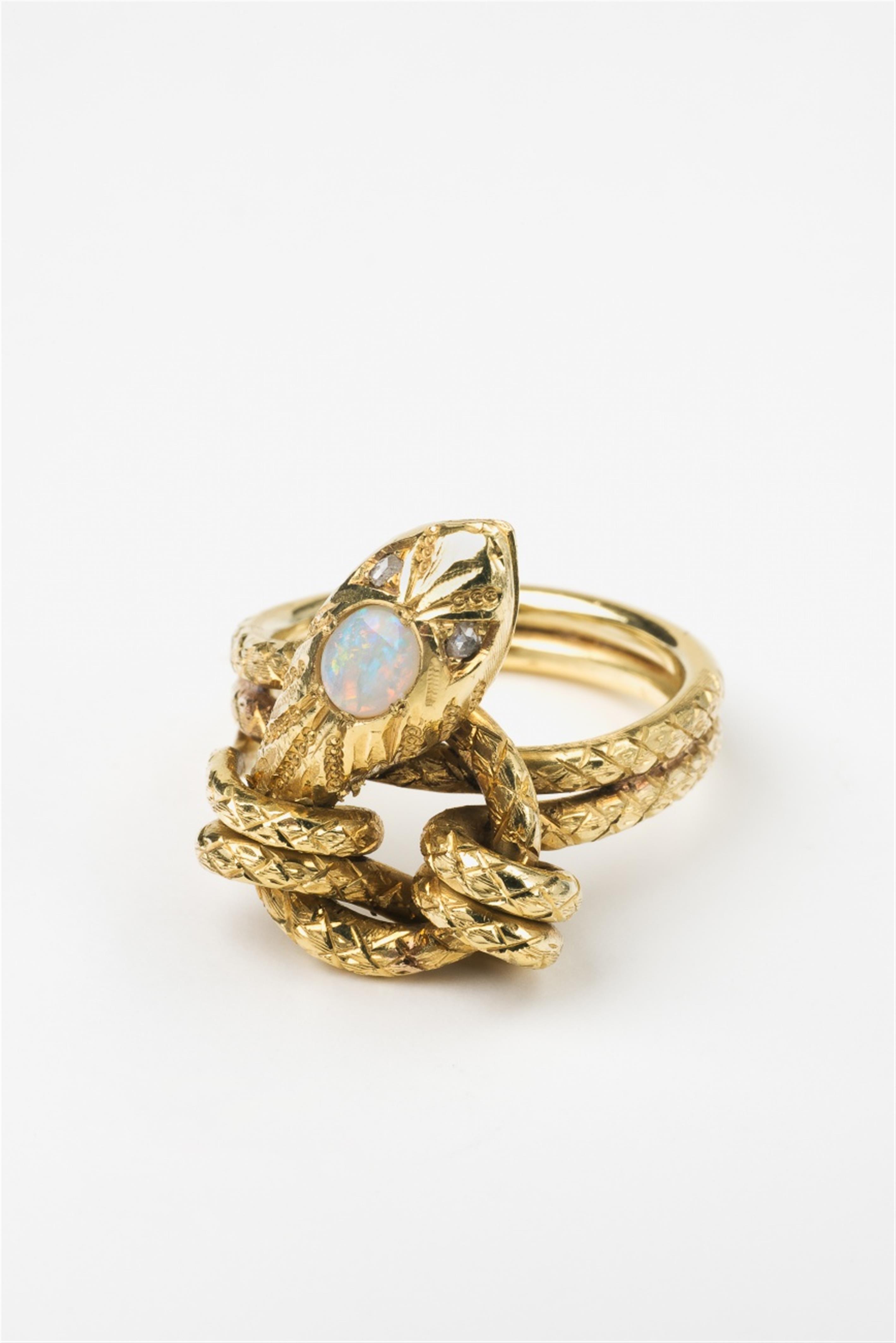 An 18k gold and opal snake ring - image-1