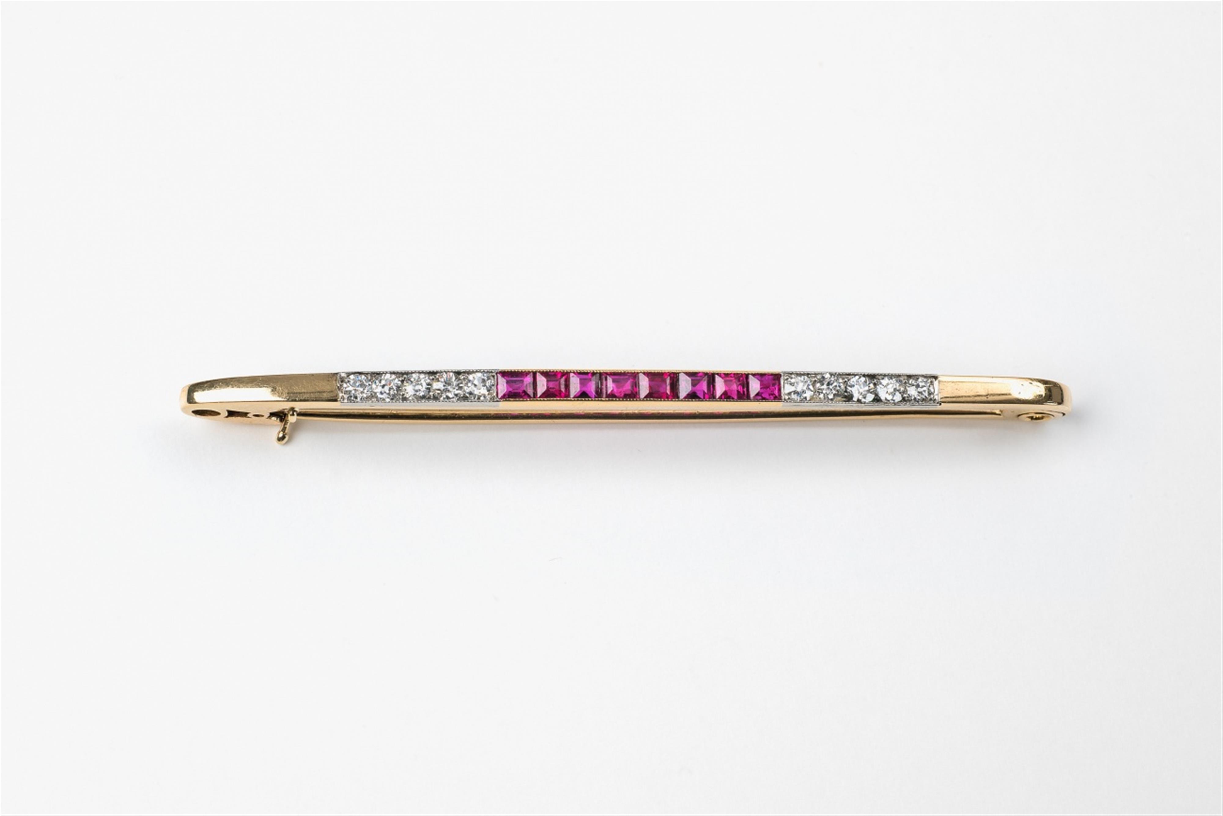 A 14k gold and ruby bar brooch - image-1