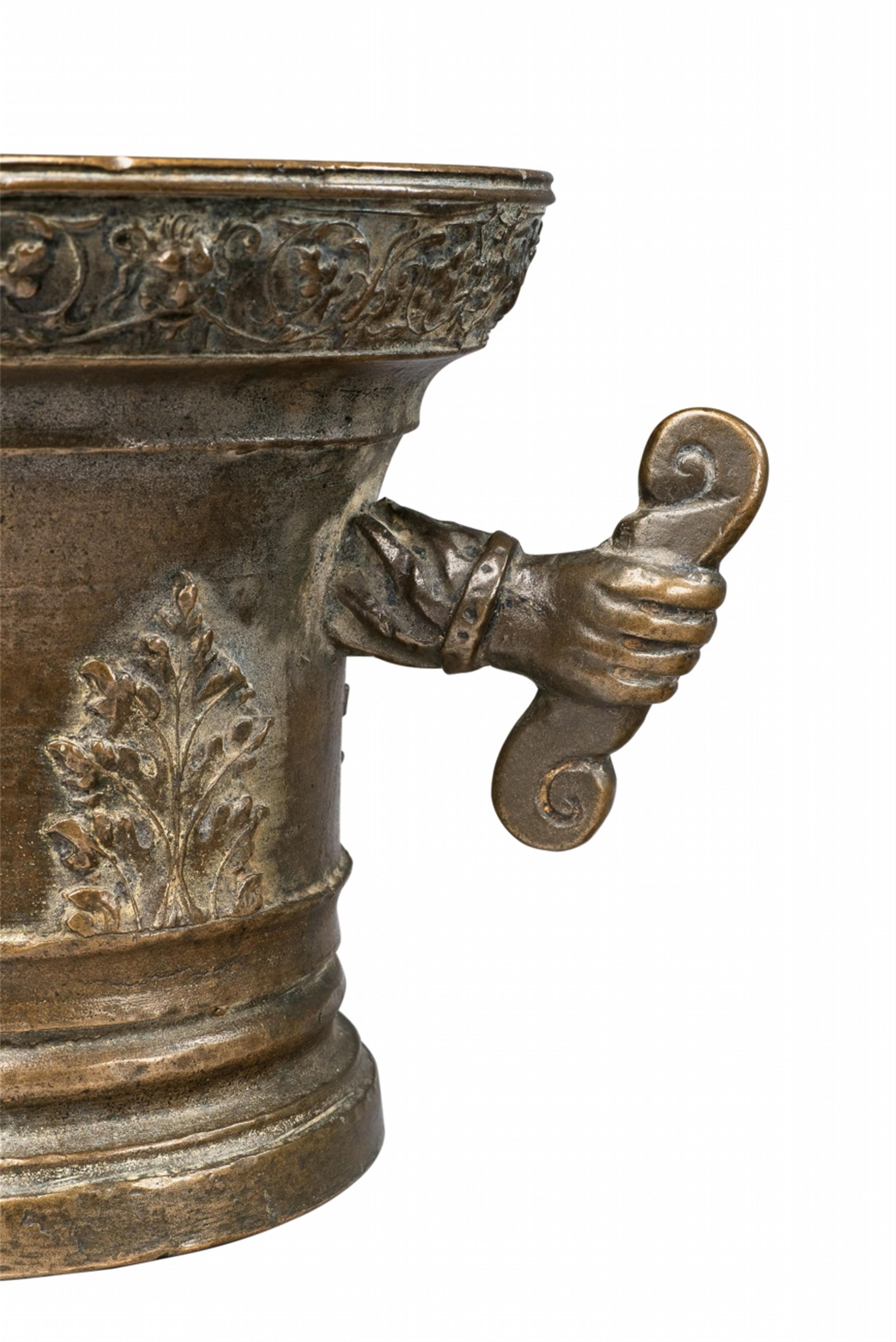 An unusual mortar with hand shaped handles - image-2