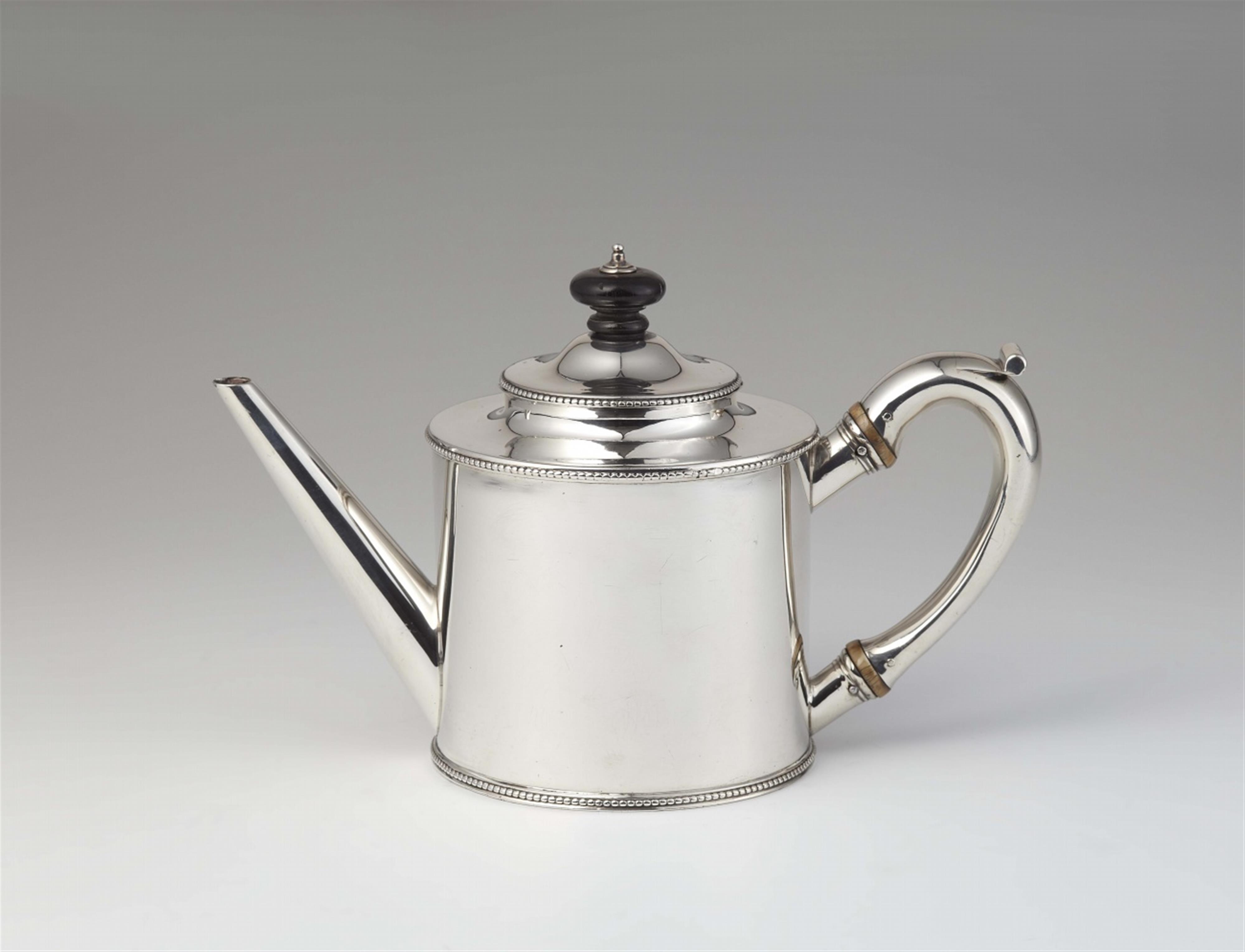 A George III silver teapot - image-1