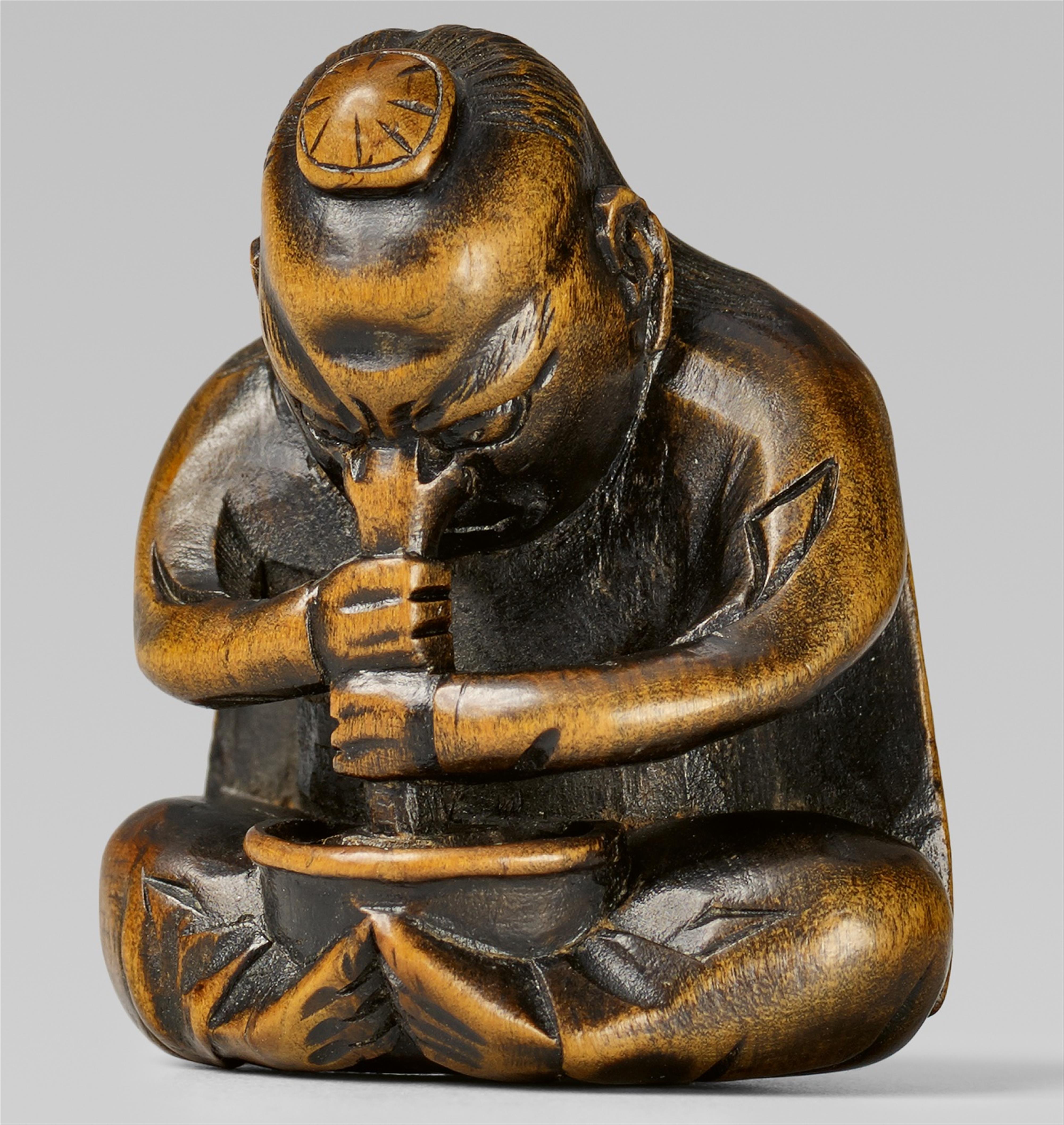 A boxwood netsuke of a long-nosed tengu. 19th century - image-1