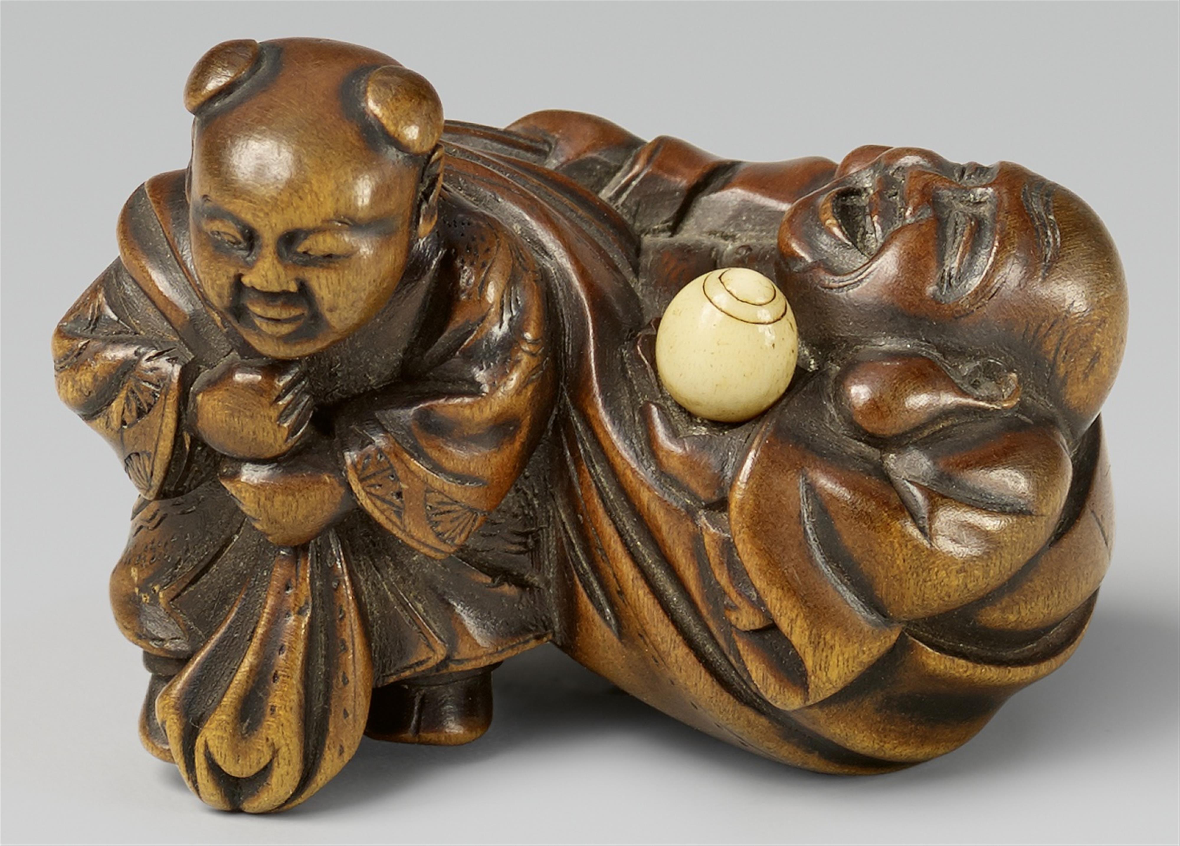 A fine boxwood netsuke of Hotei and karako. Mid-19th century - image-1