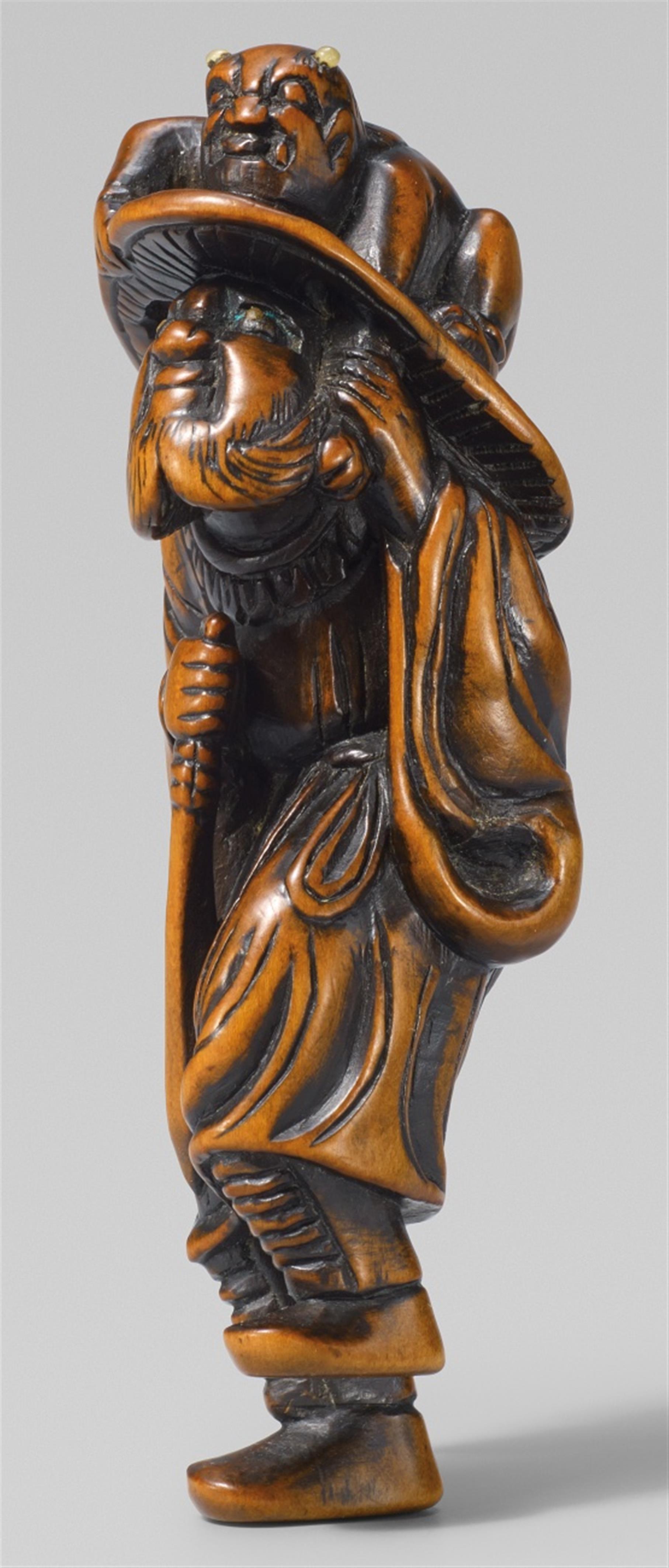 A boxwood netsuke of Shôki and an oni. Late 18th century - image-1