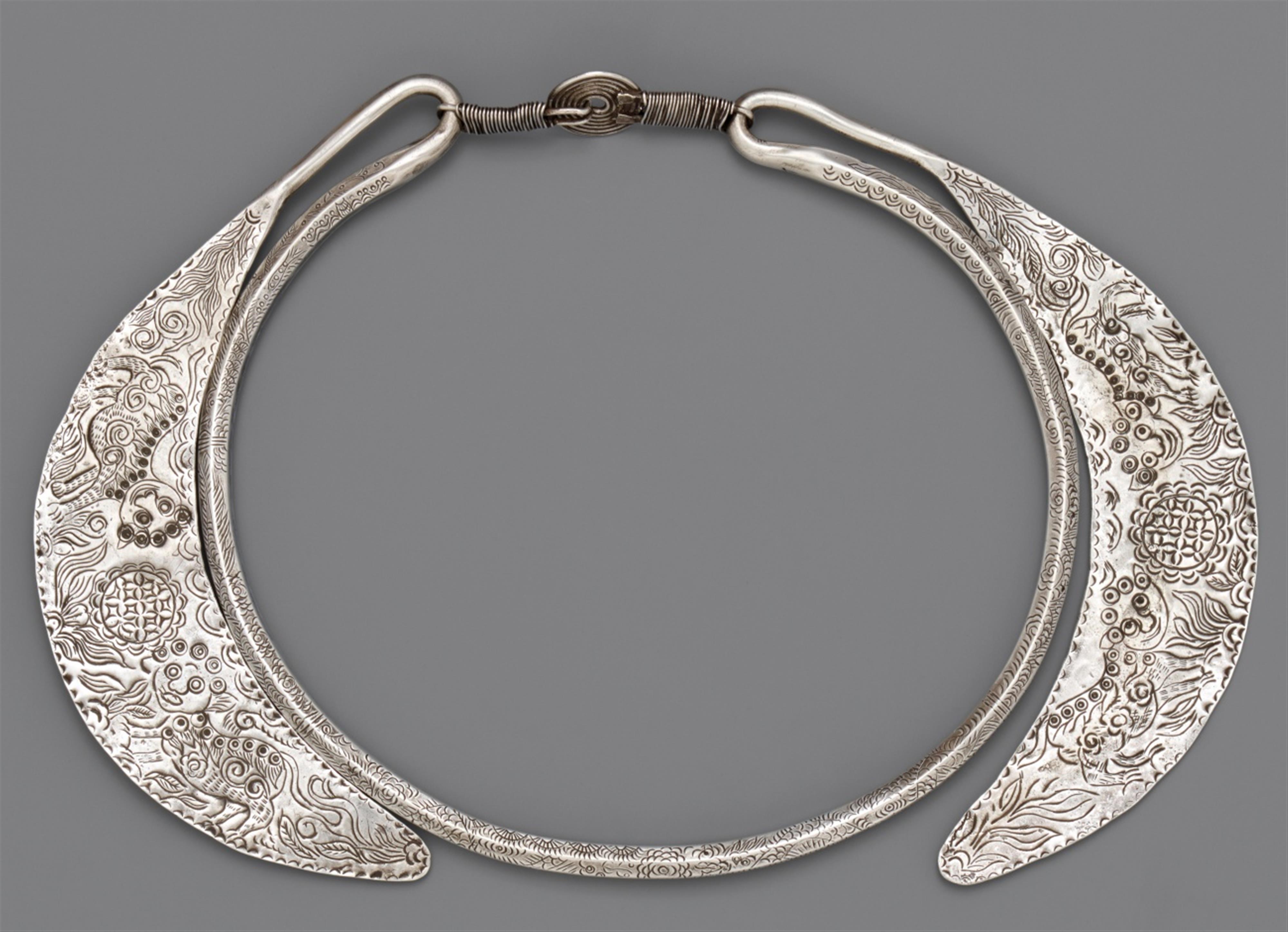 A silver pectoral of the Miao and Yi tribes. Southern China, Yunnan province, Malipo district - image-1