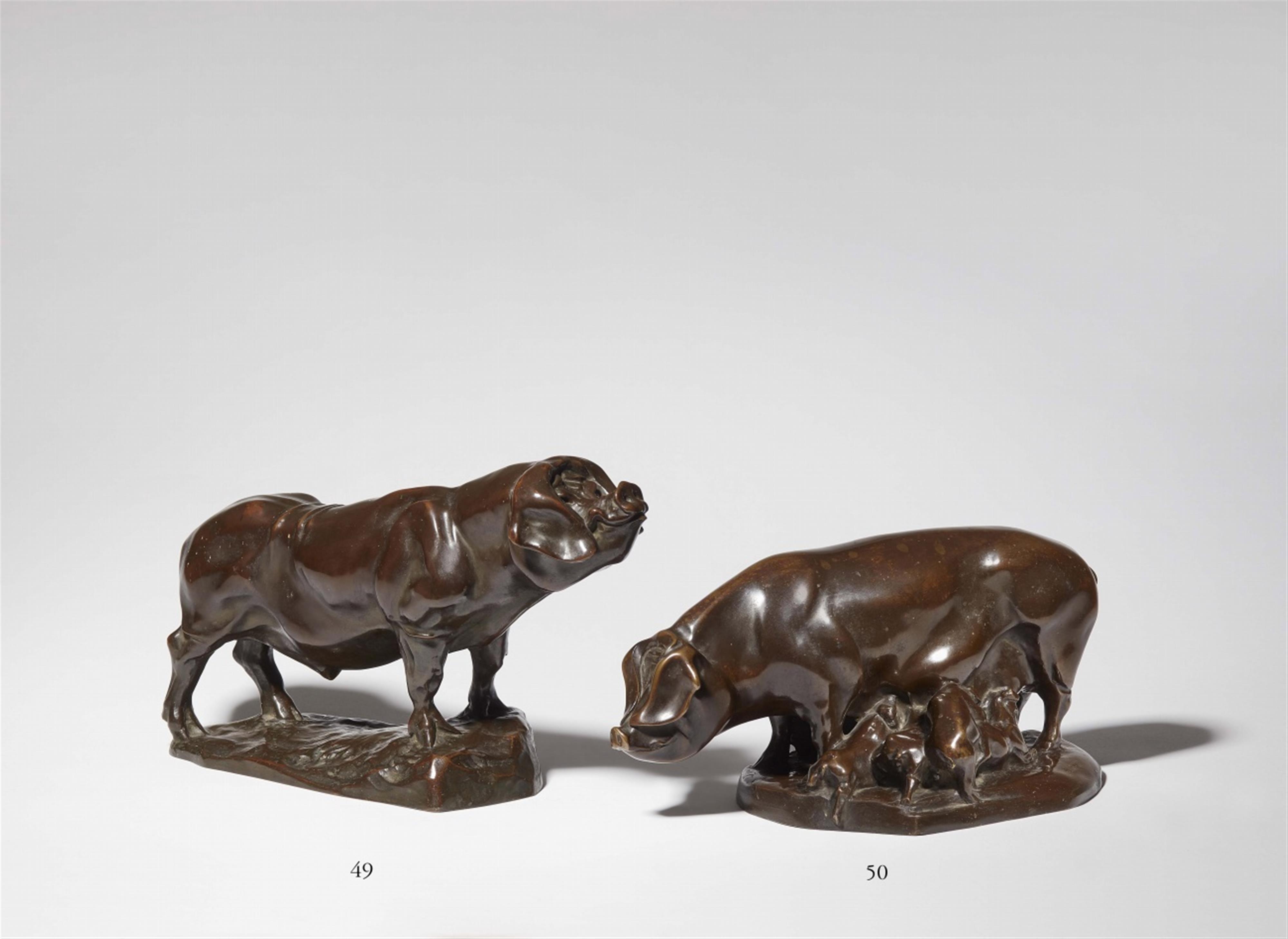 A bronze figure of a pig with piglets - image-1