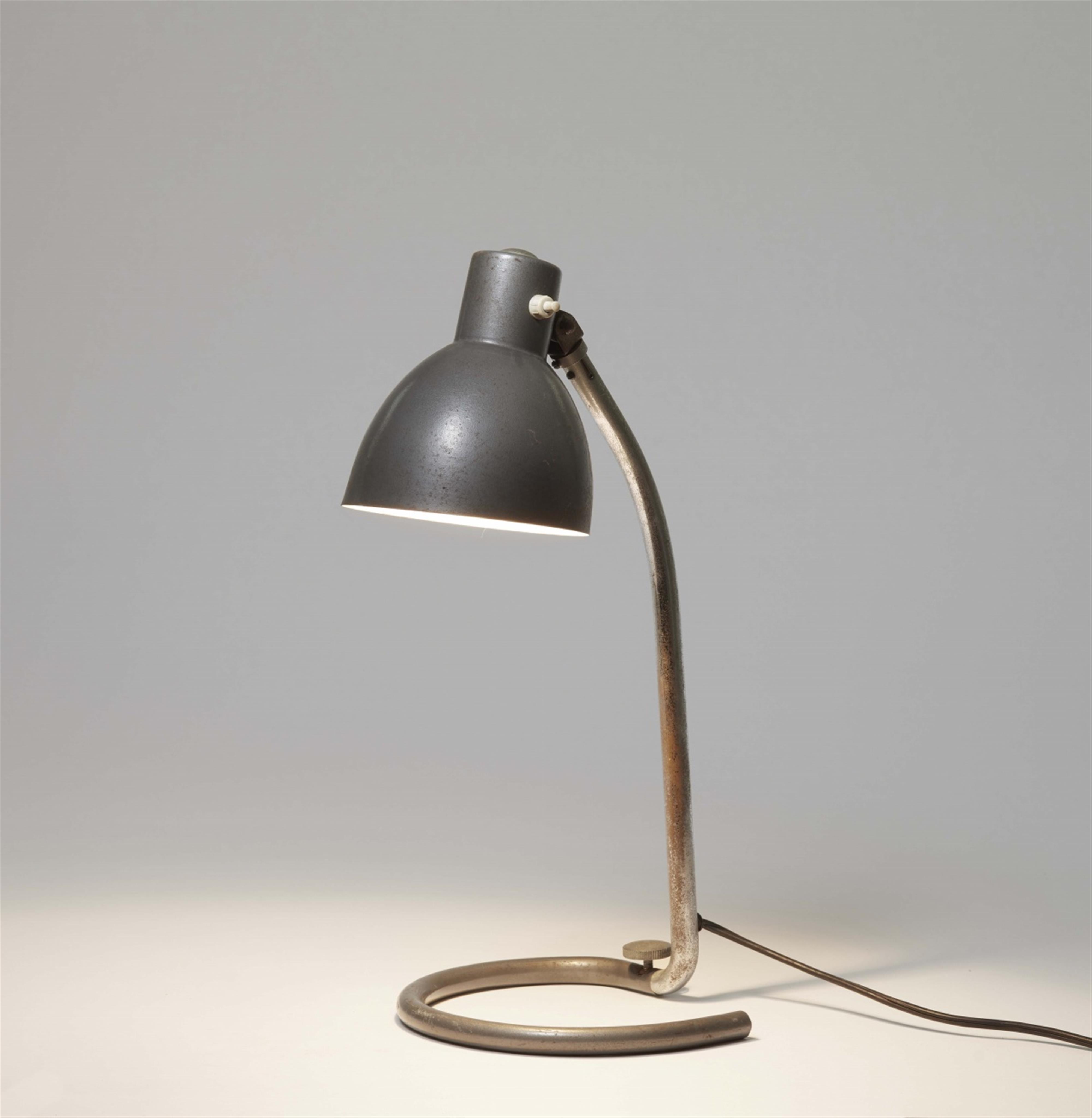 A tubular steel table lamp - image-1