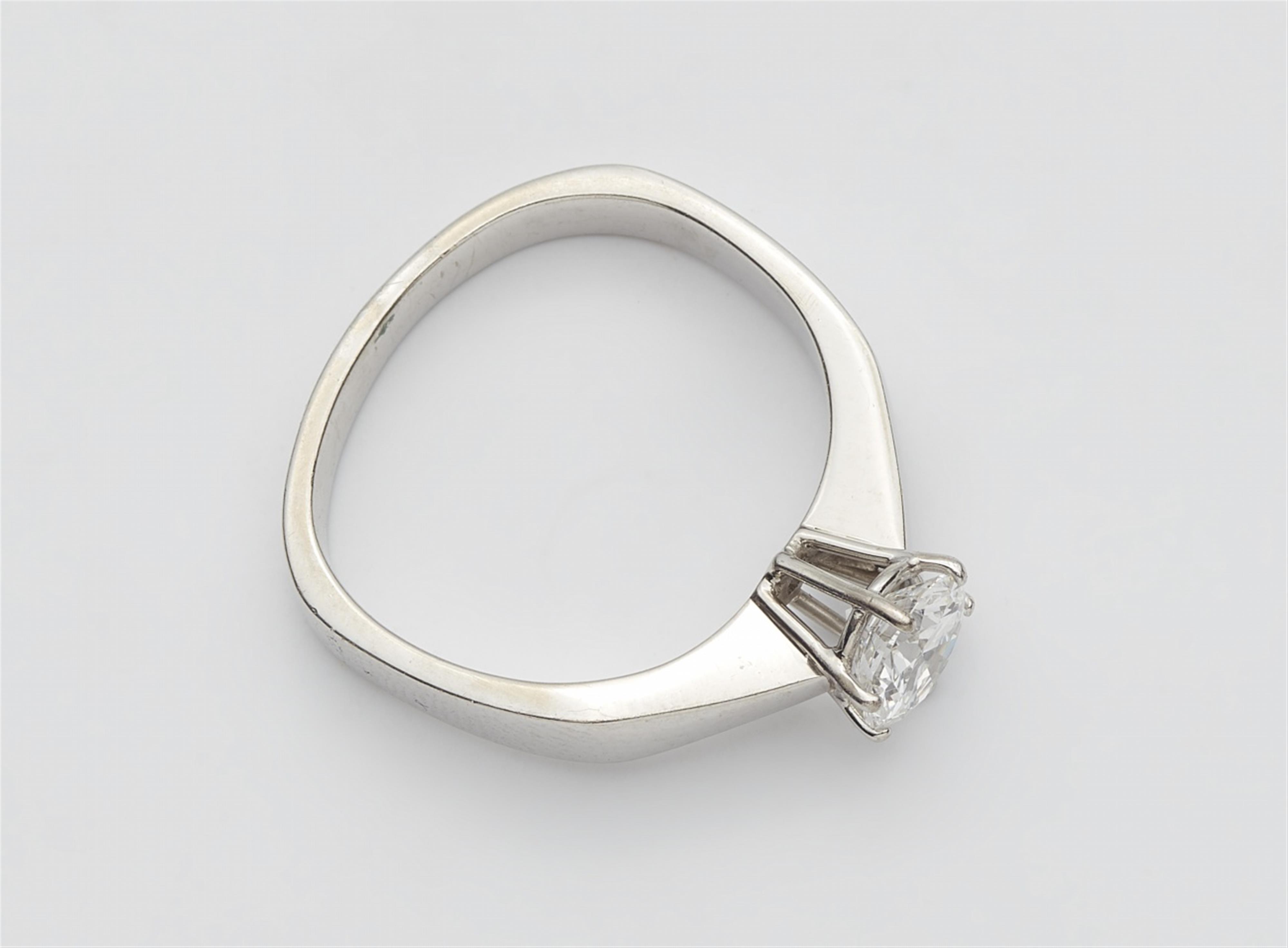 A 14k white gold ring with a brilliant-cut diamond solitaire - image-2