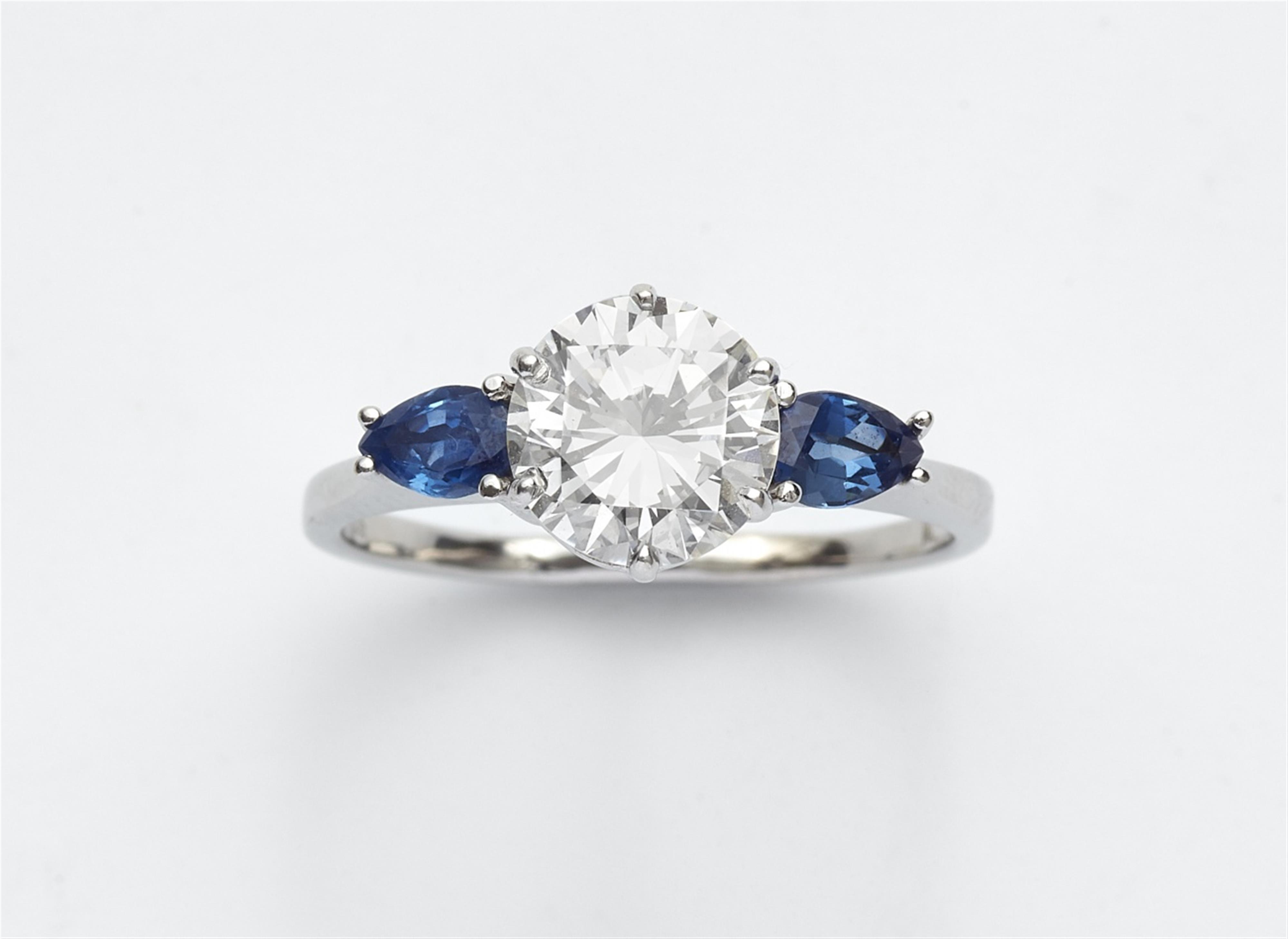 An 18k white gold, sapphire, and diamond ring - image-1