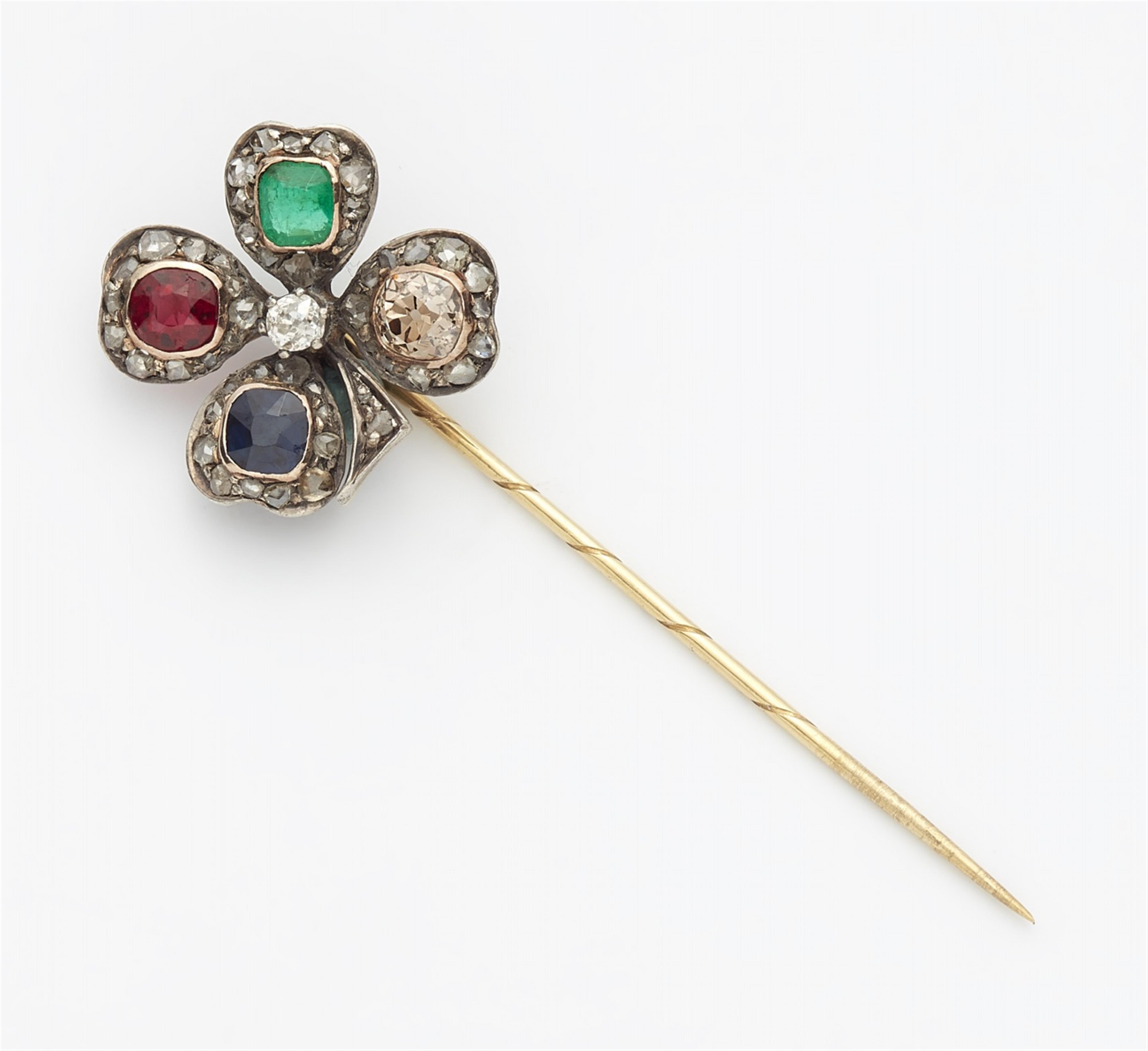 A clover leaf pin with coloured gemstones - image-1