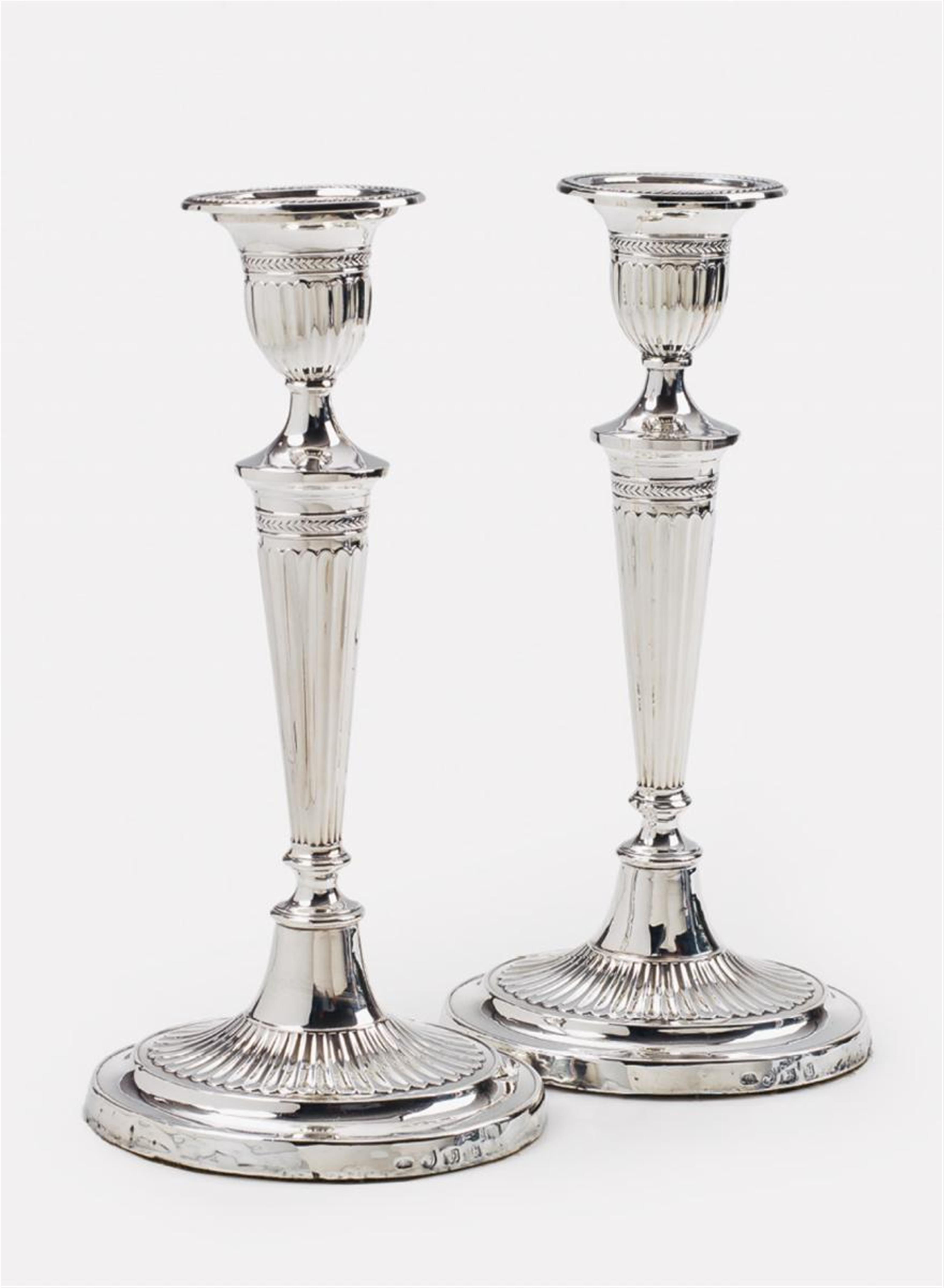 A pair of George III silver candlesticks - image-1