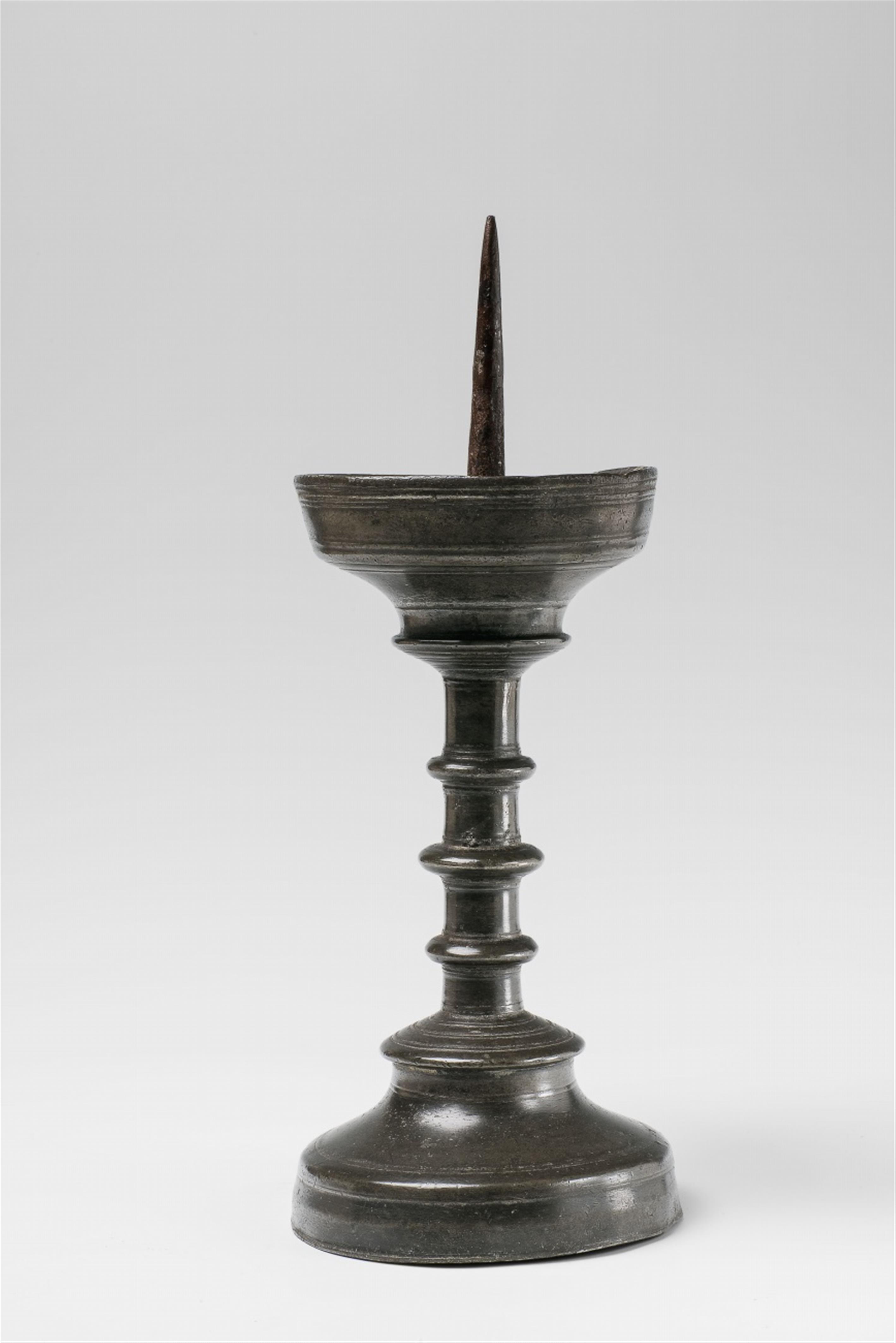 A Gothic tin candlestick - image-1