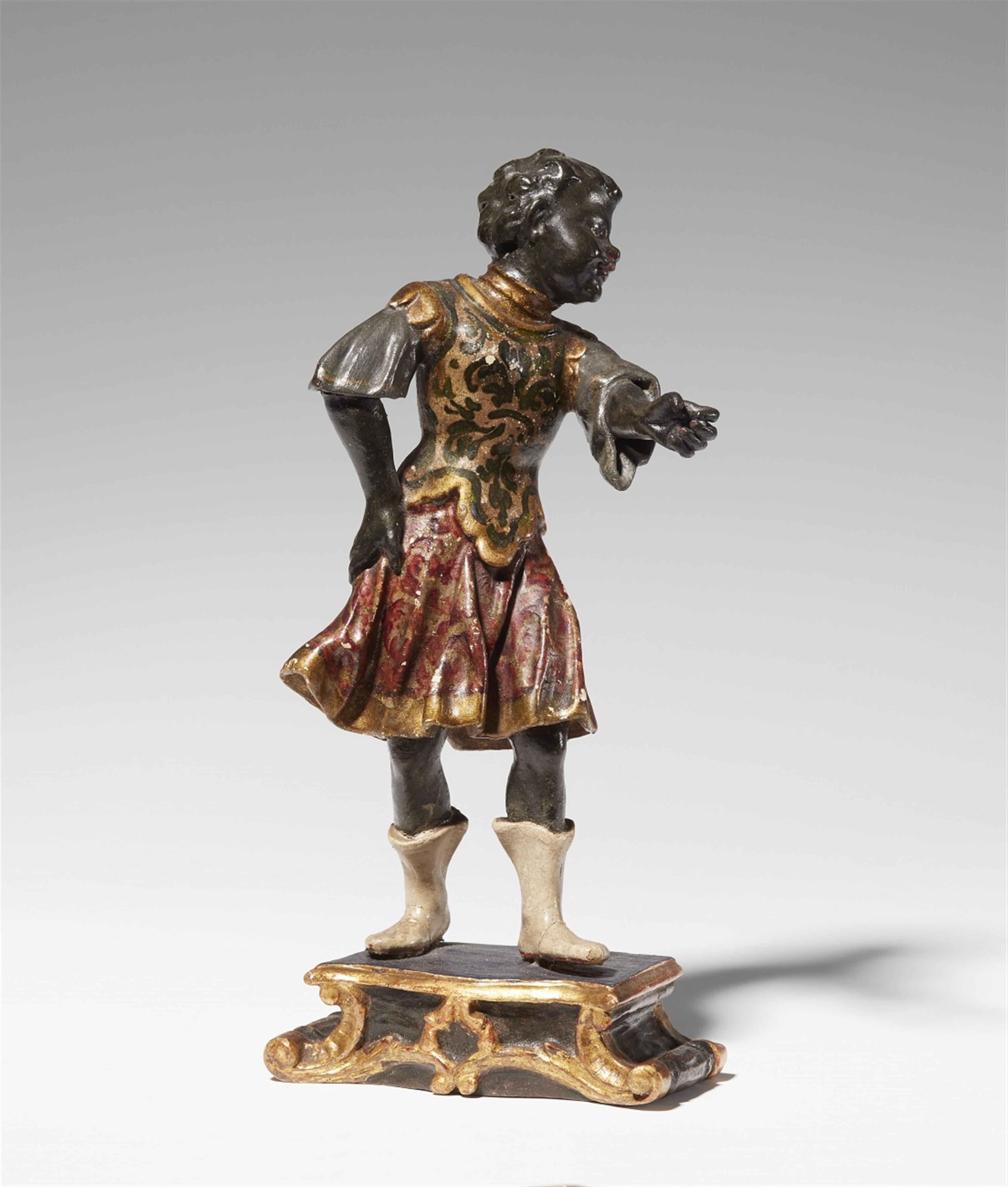 A carved softwood statuette of a Venetian soldier - image-1