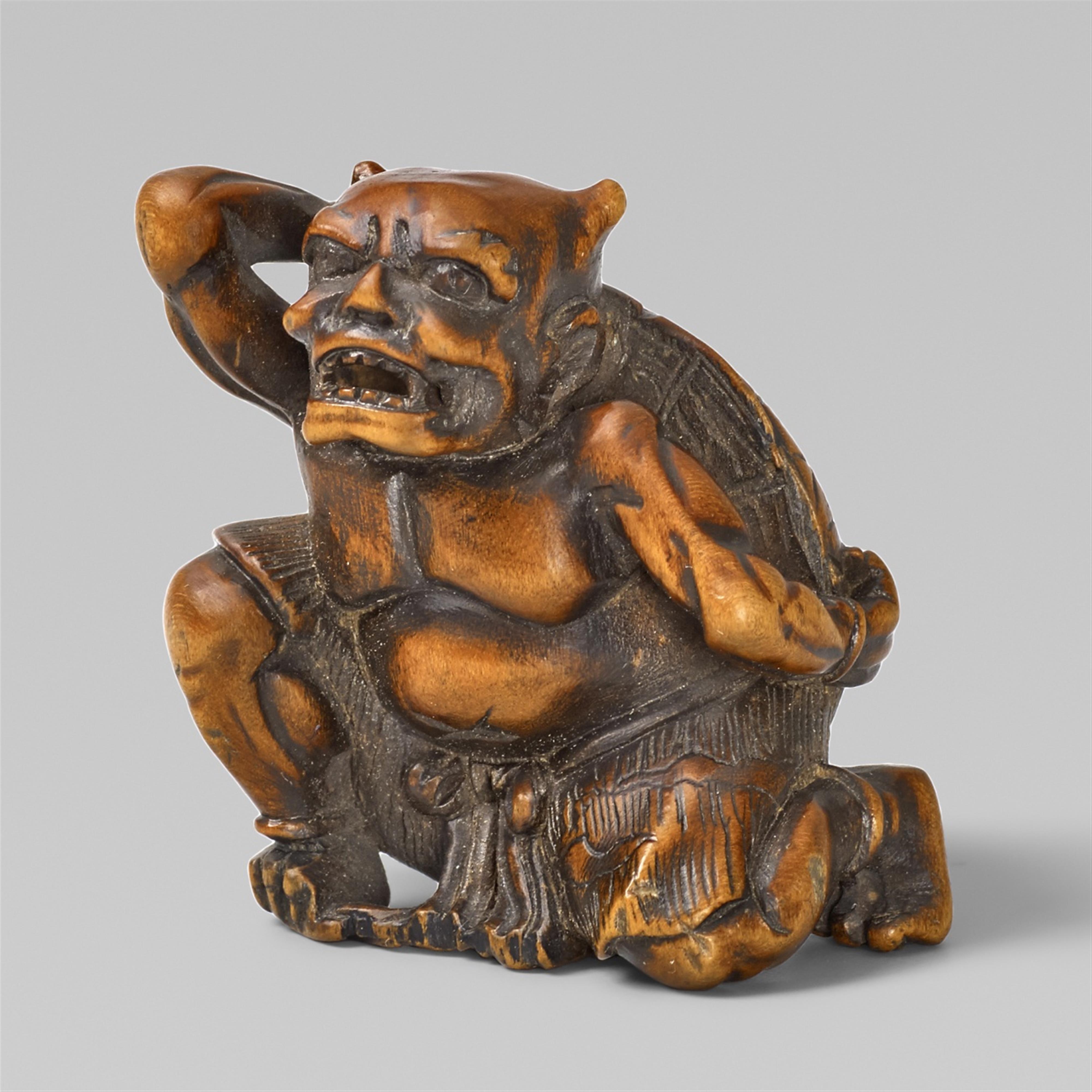 A boxwood netsuke of an oni on setsubun. 19th century. - image-1