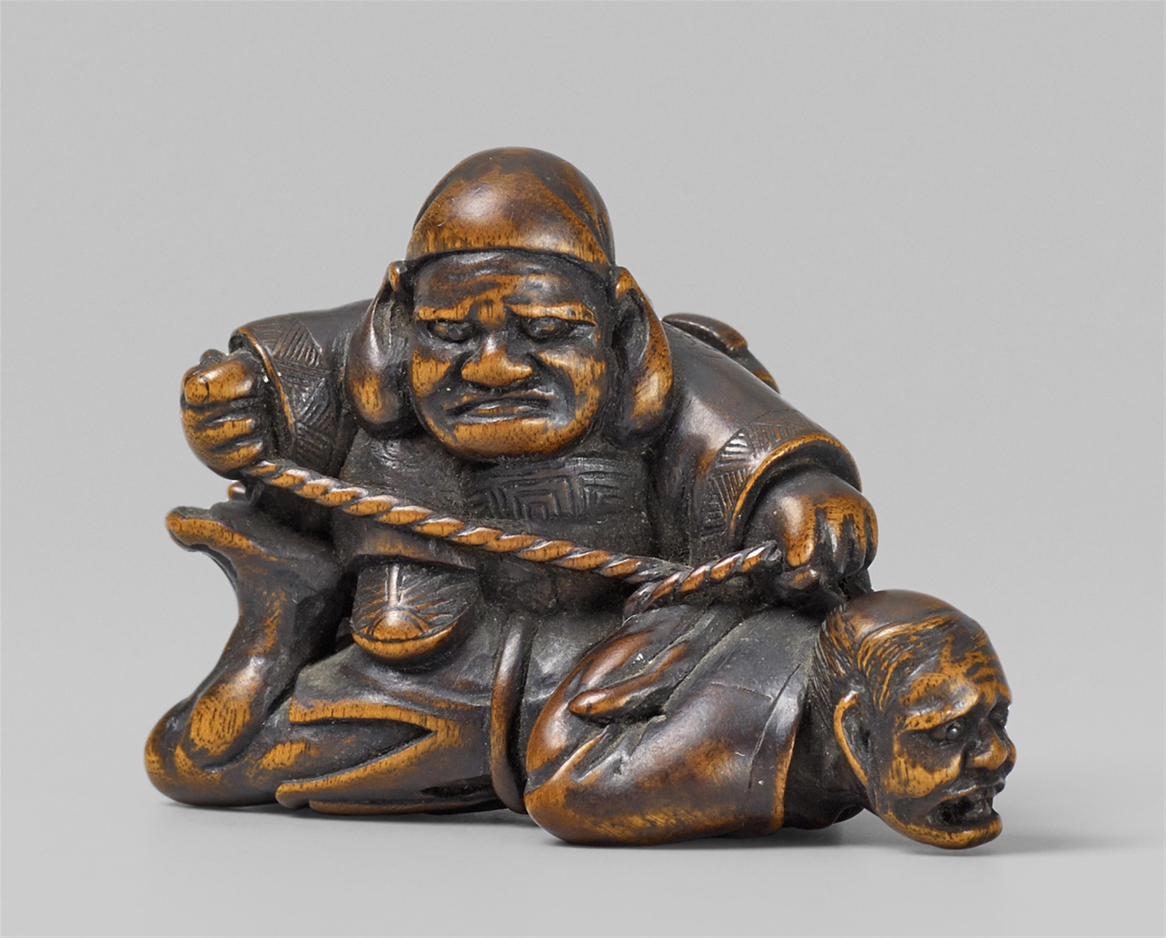 A boxwood netsuke of Daikoku catching a thief. Early 19th century - image-1