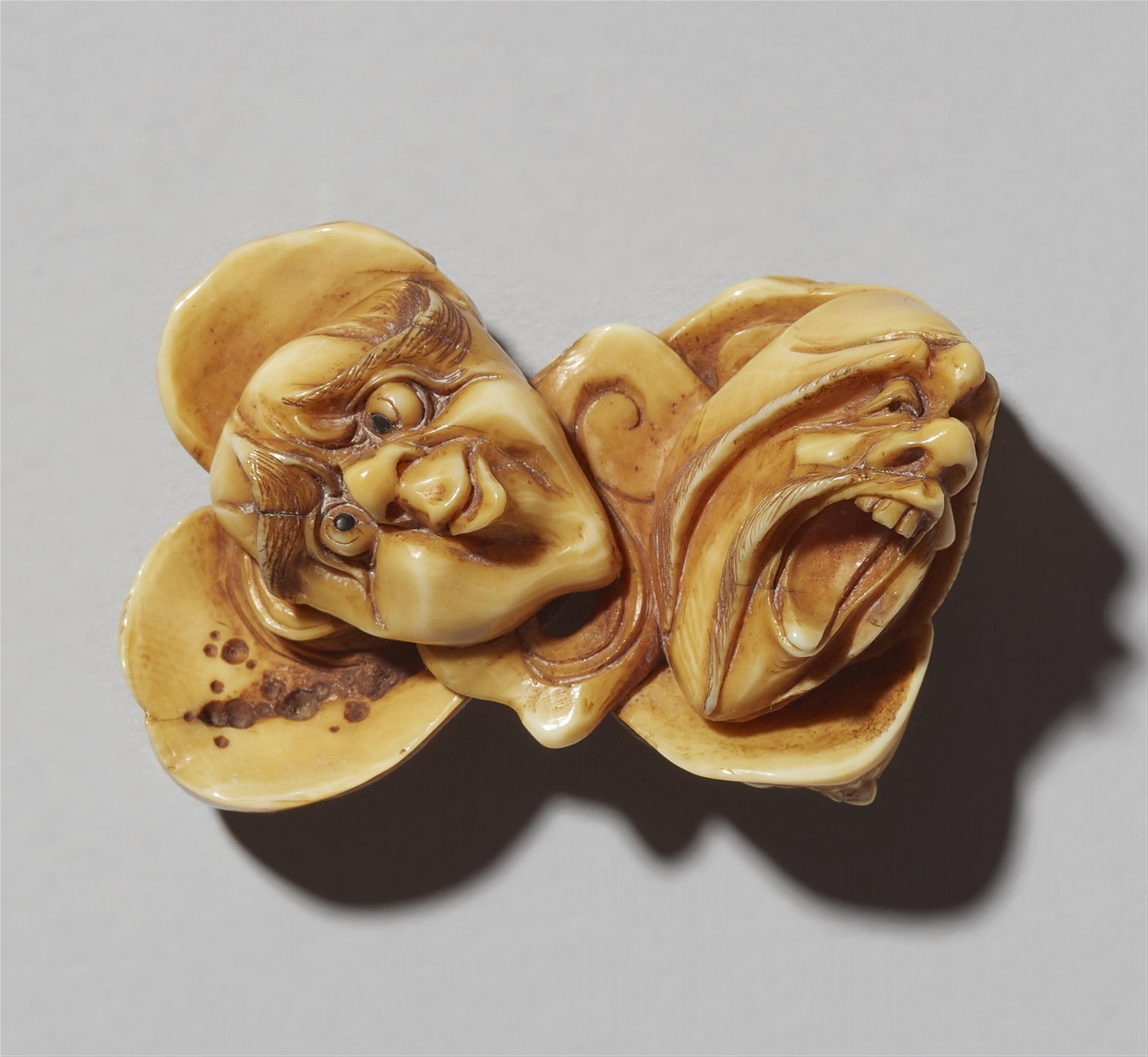 An ivory netsuke of six grotesque masks. Late 19th century - image-1