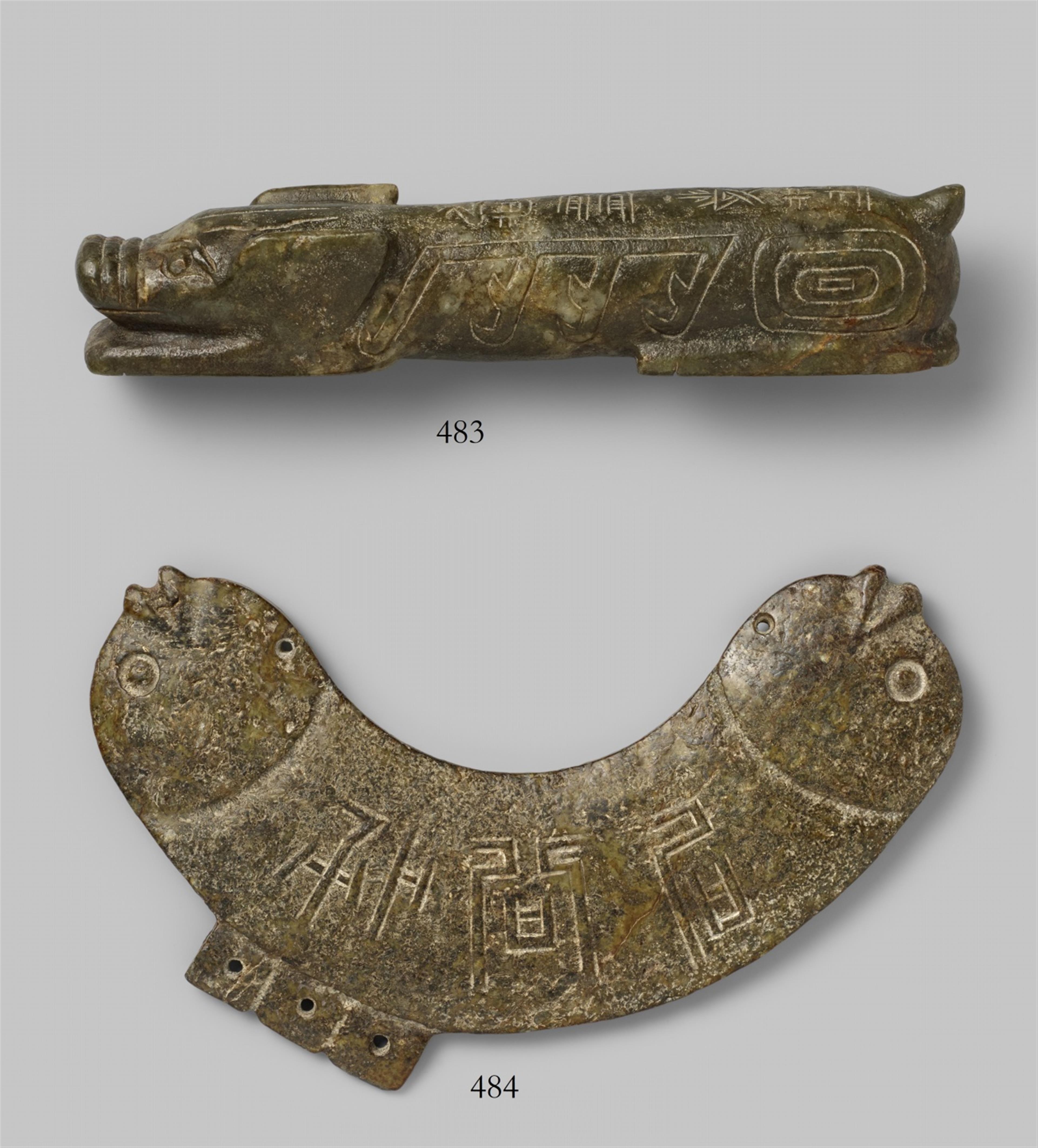 A brownish mottled stone pendant in archaic style - image-1