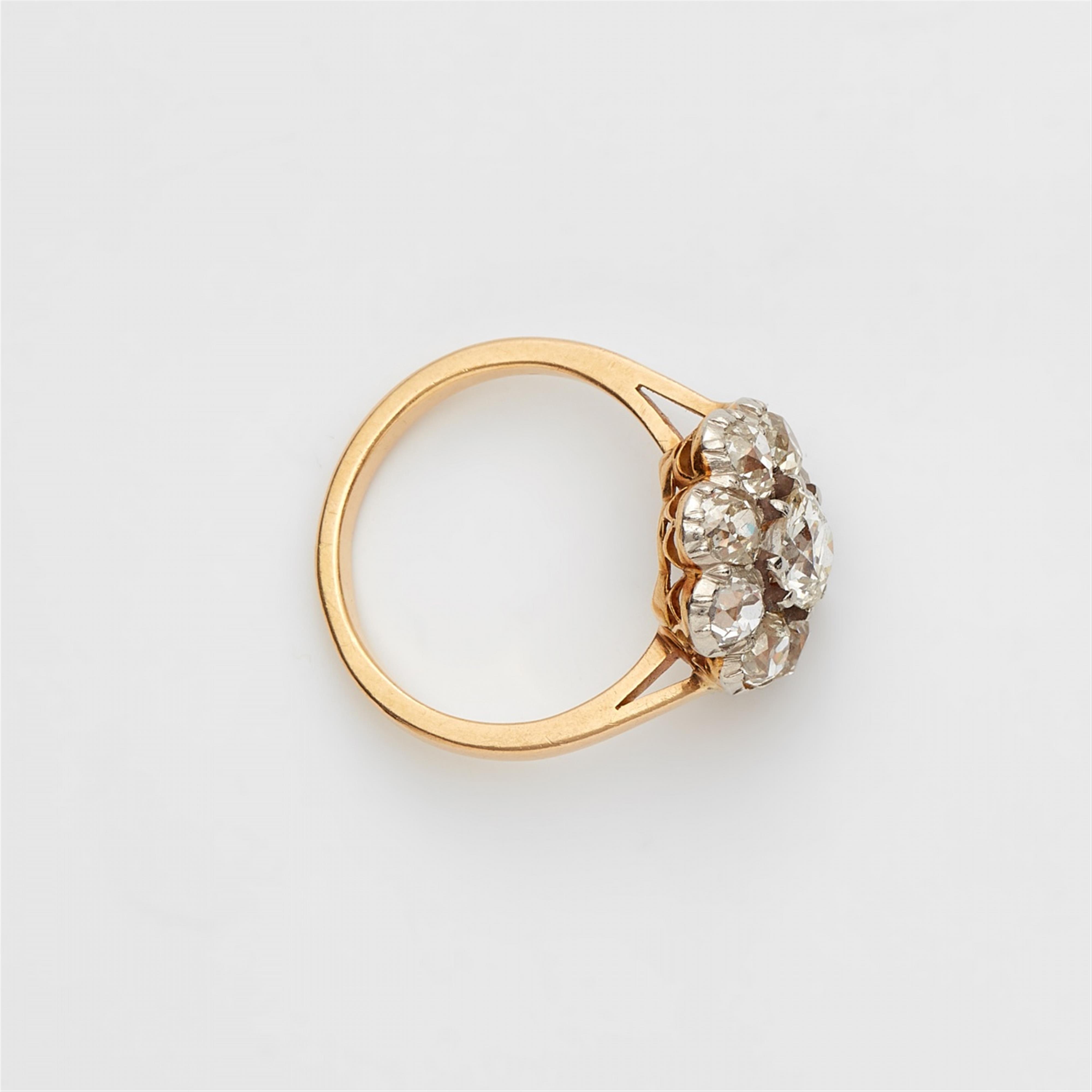 An 18k gold and diamond cluster ring - image-2
