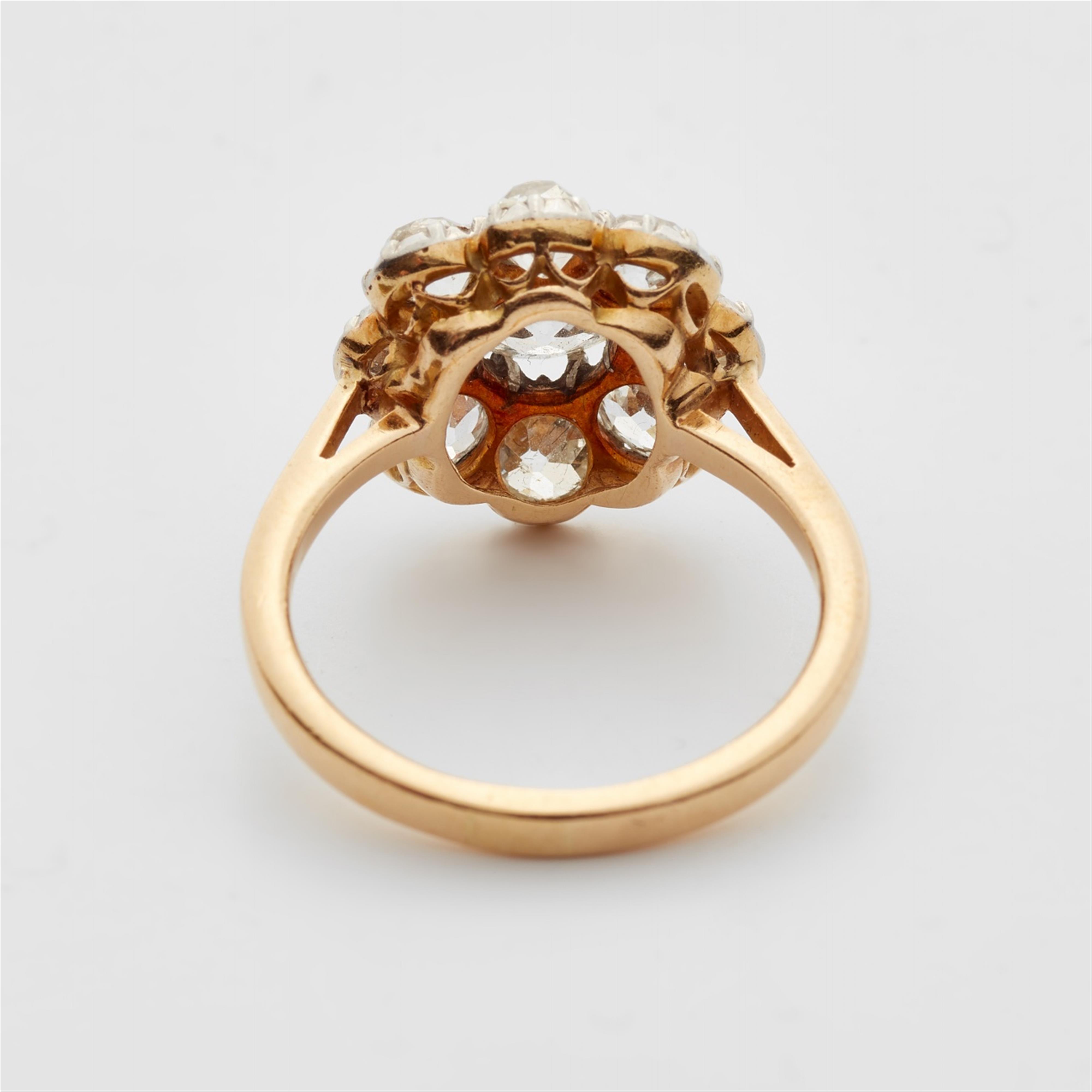 An 18k gold and diamond cluster ring - image-3