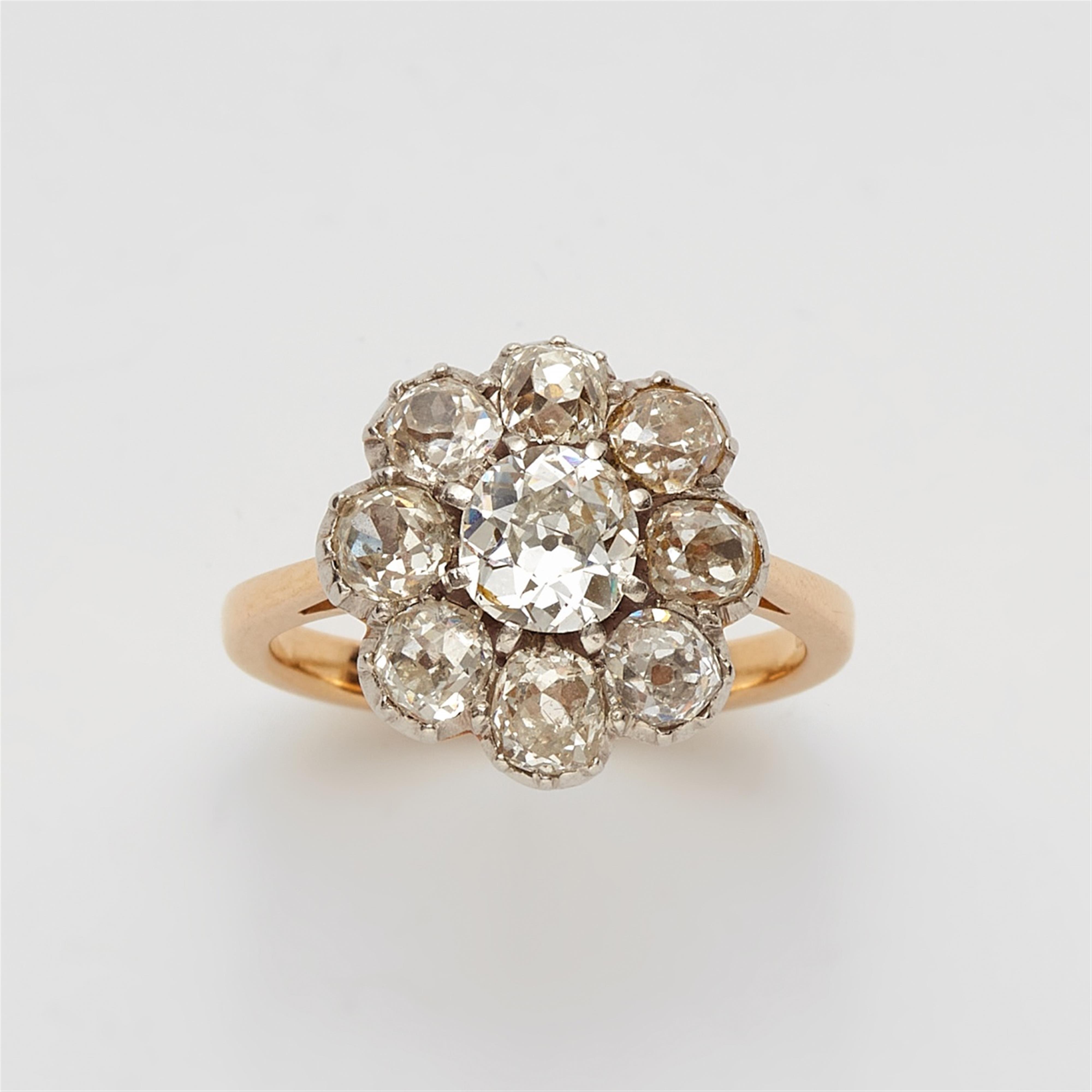 An 18k gold and diamond cluster ring - image-1