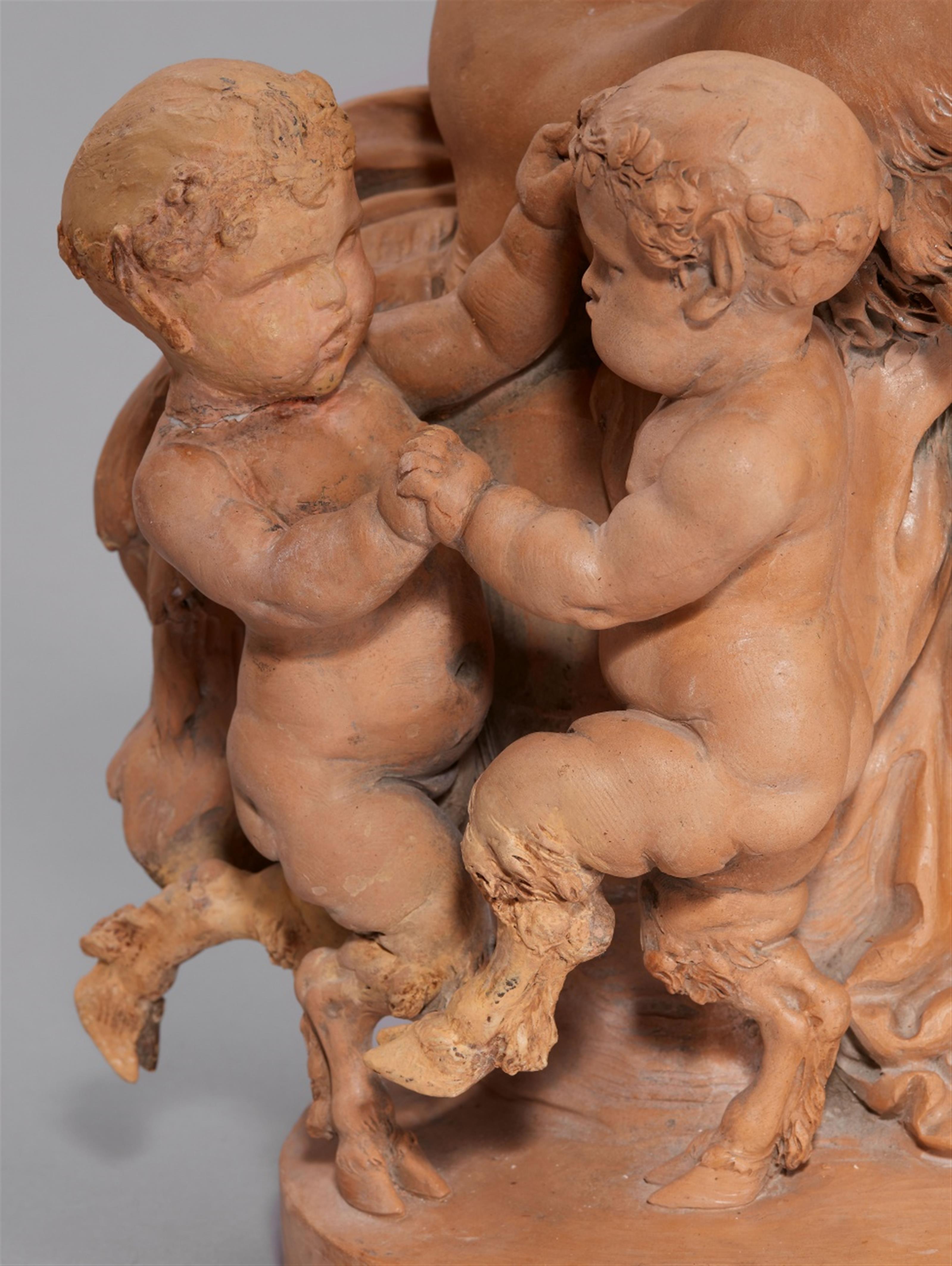 A terracotta group with a faun playing the flute - image-4