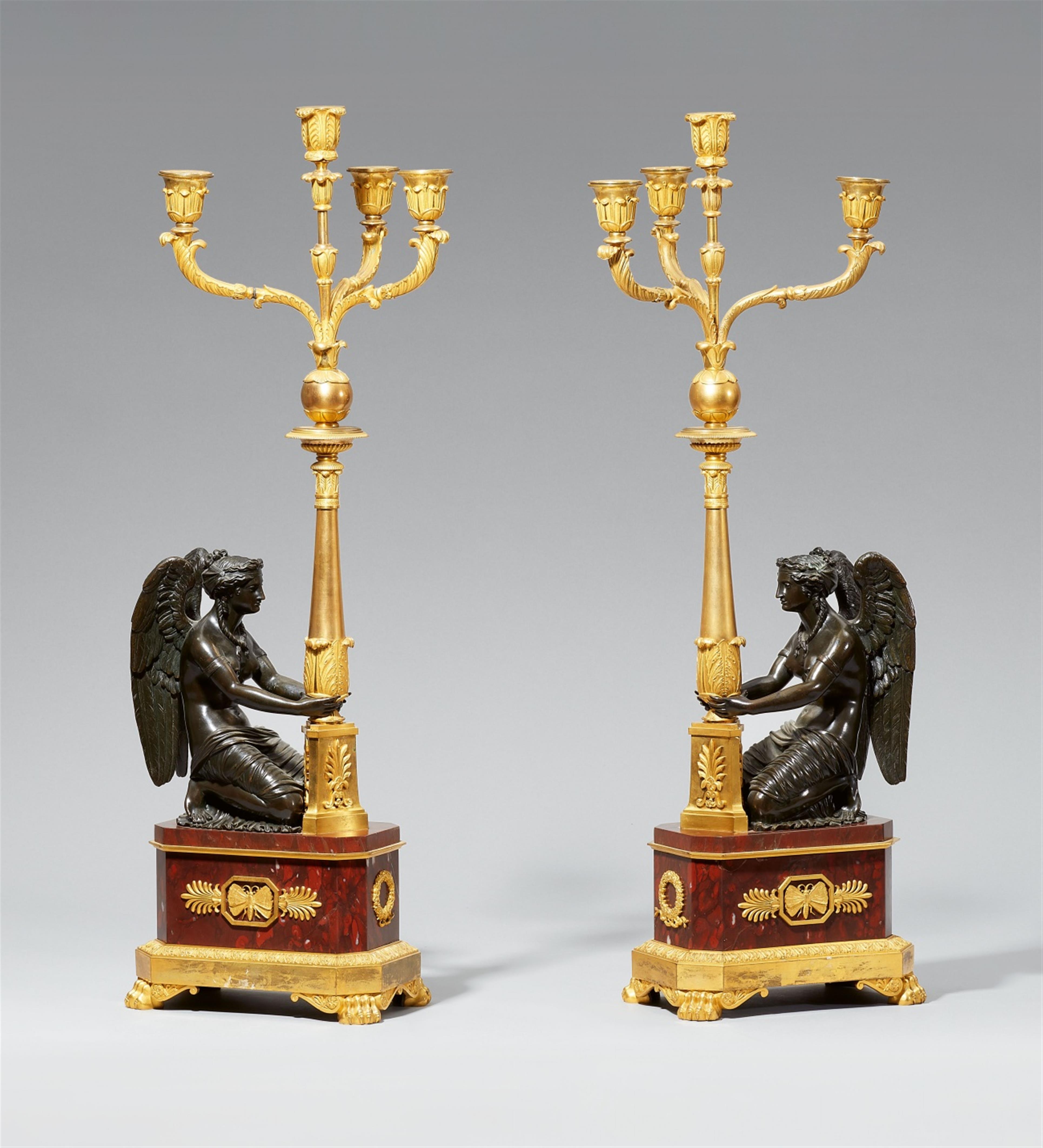 A rare pair of ormolu candelabra with kneeling figures of Victory - image-1