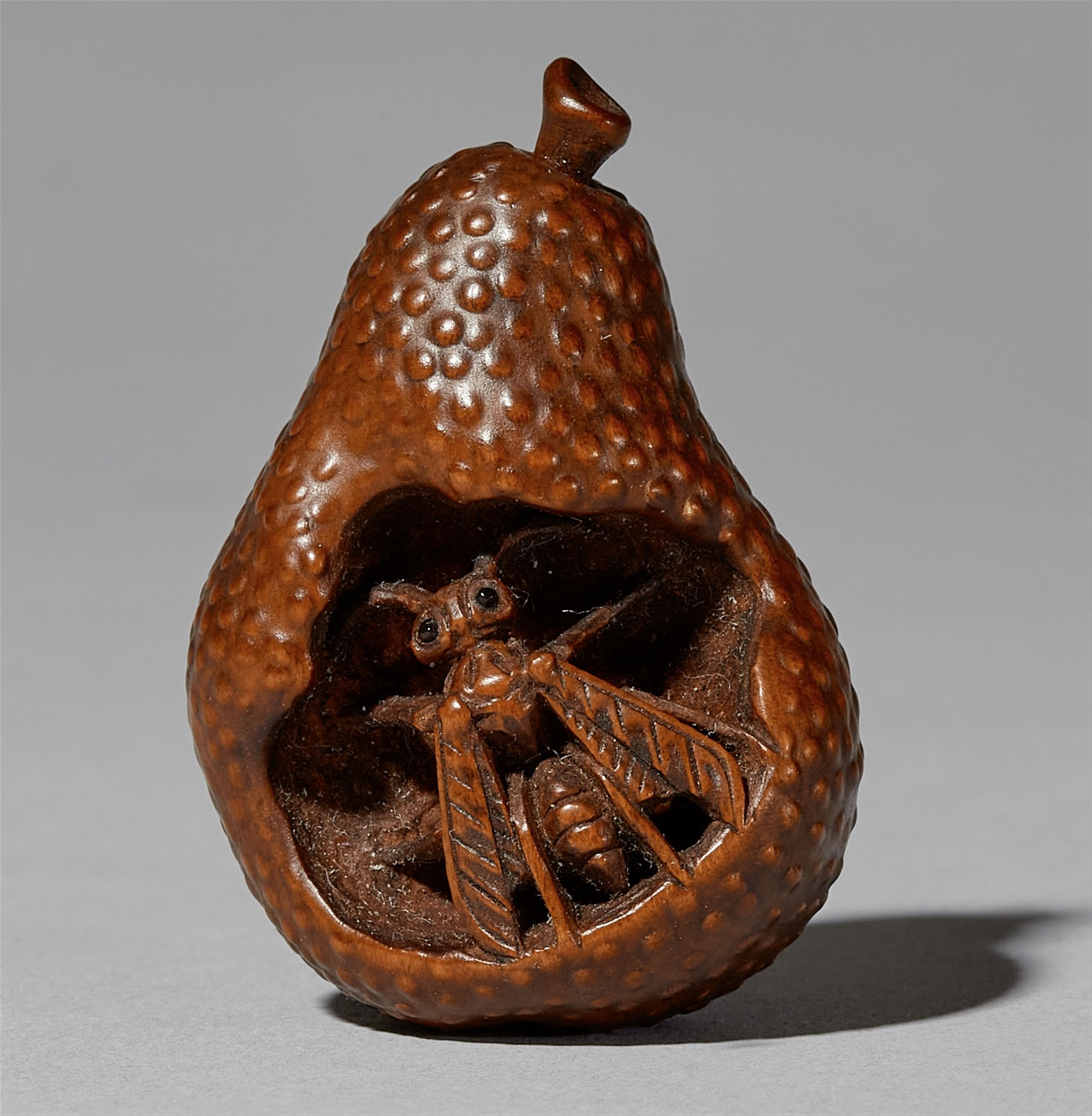 A boxwood netsuke of a wasp in a pear. Mid-19th century - image-1