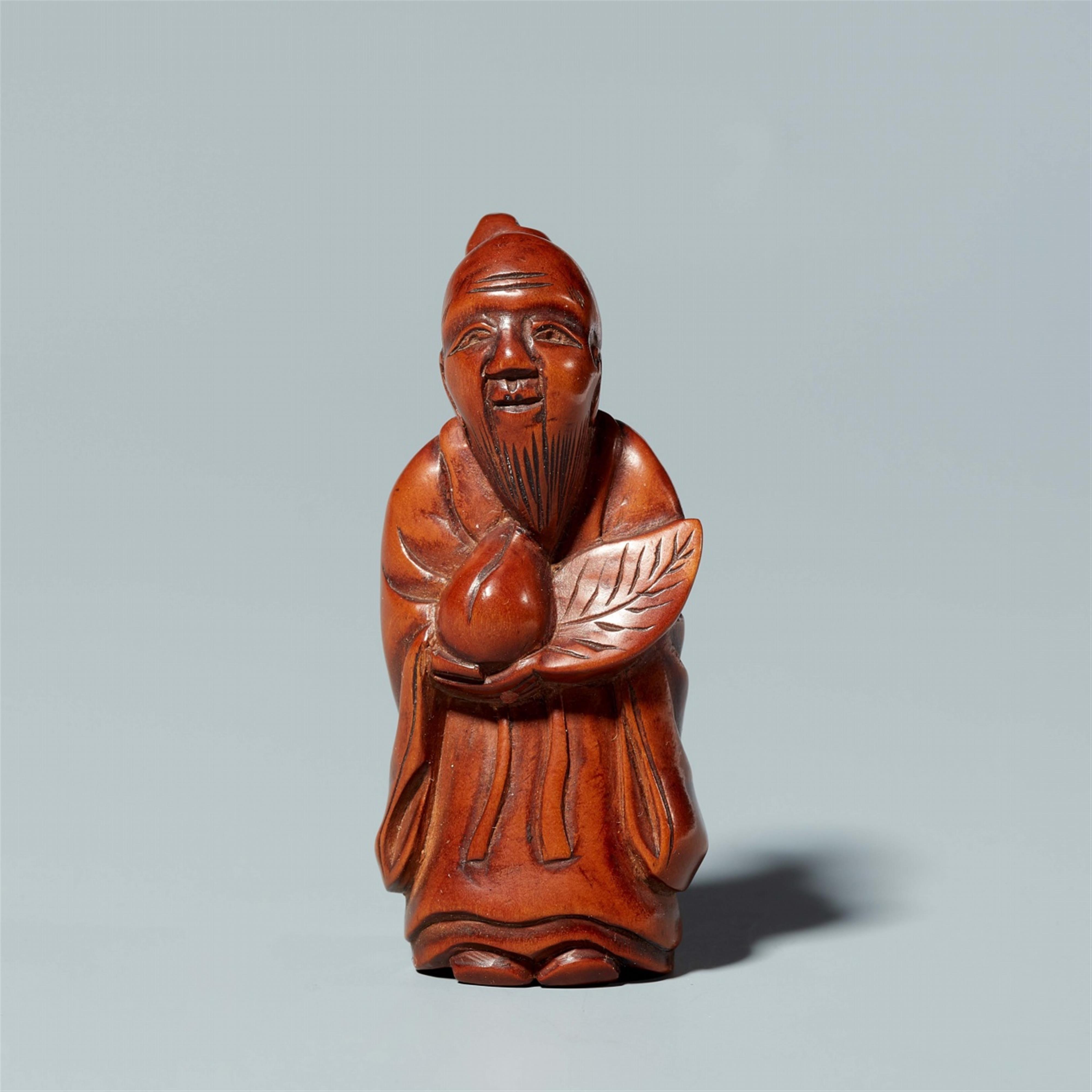 A boxwood netsuke of a sage. Around 1900 - image-1