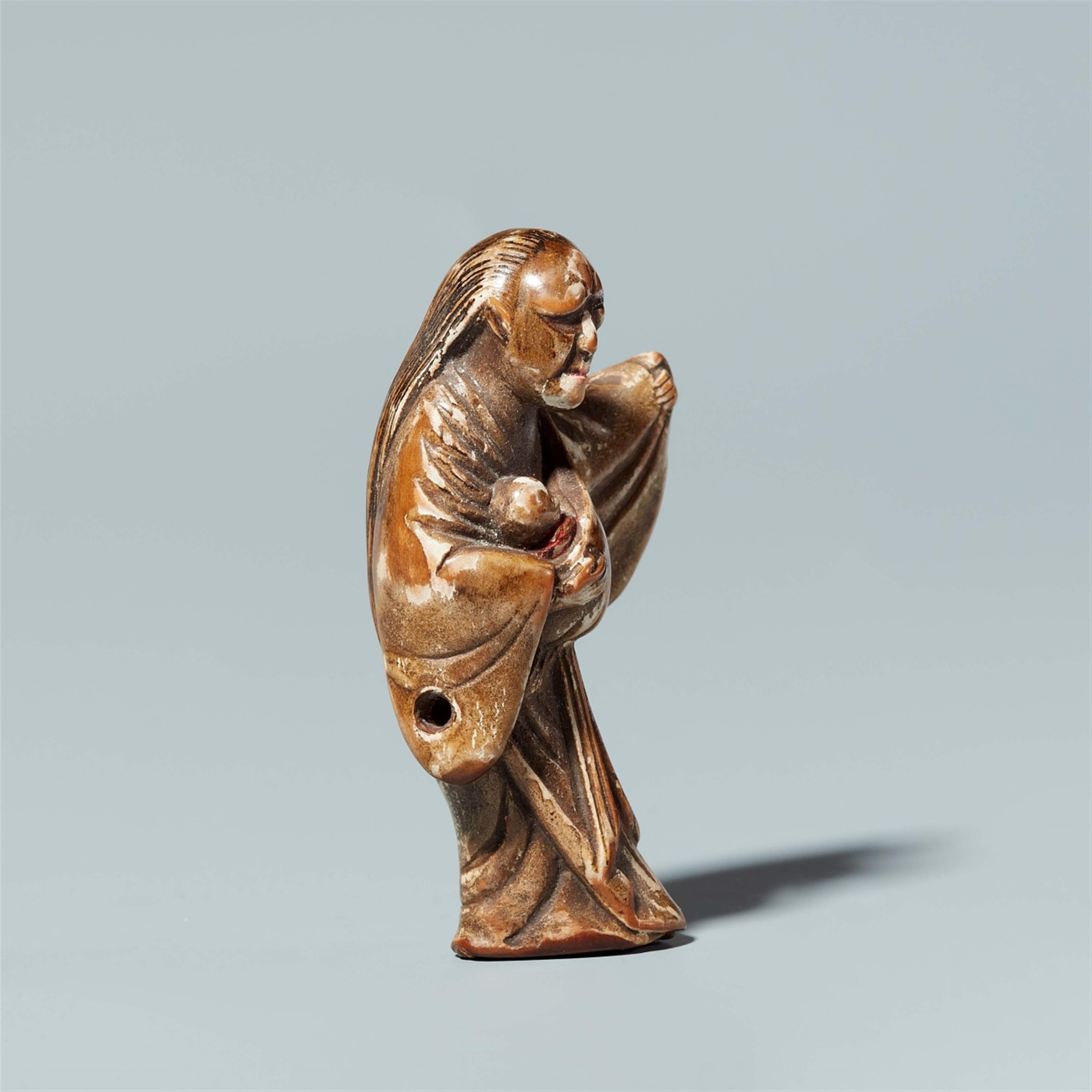 A wood and lacquer netsuke of a demon with a child. Late 19th century - image-4