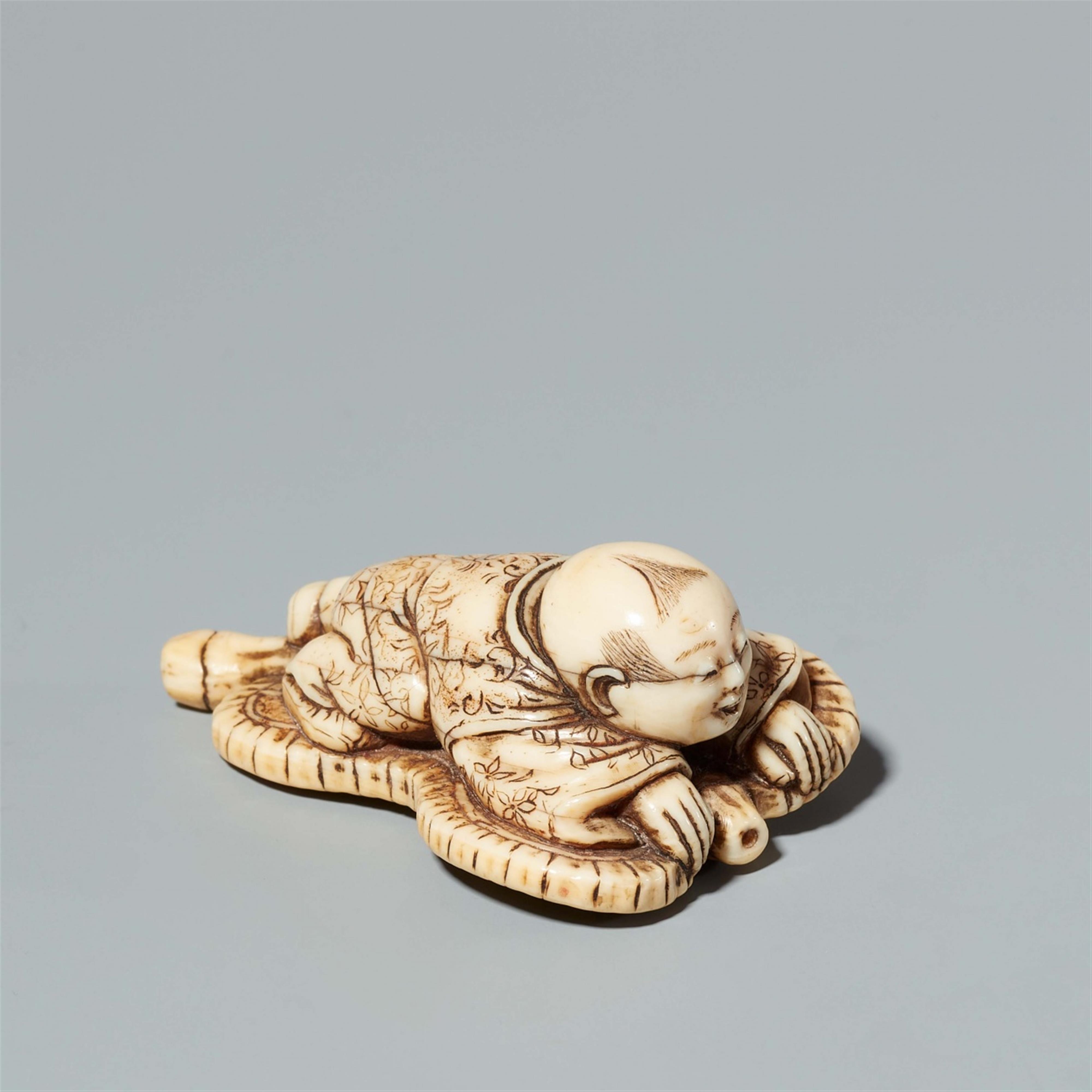 An Osaka school ivory netsuke of a karako on a fan, by Hidemasa. Mid-19th century - image-1