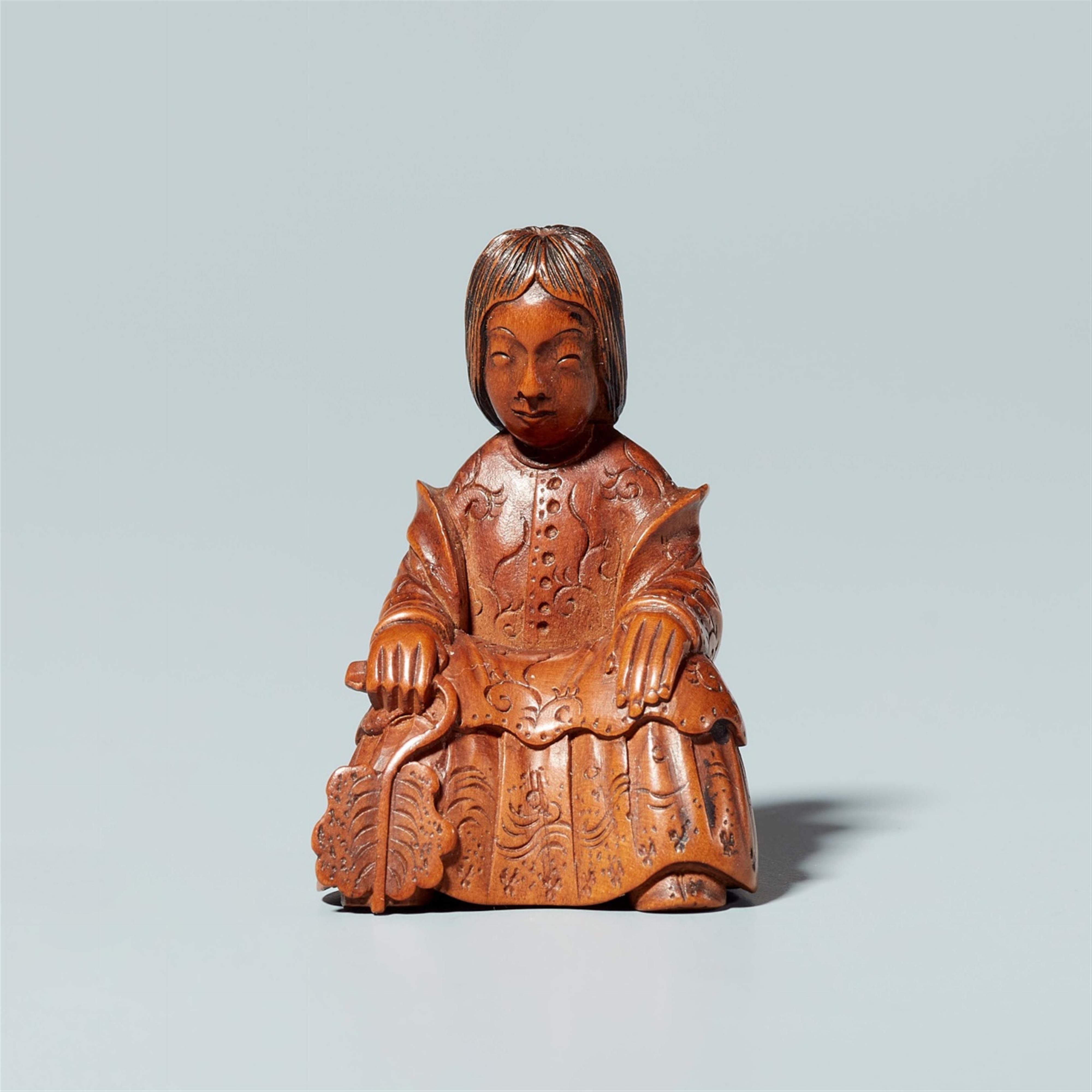 A boxwood netsuke of a lady seated on a stool. Mid-19th century - image-1