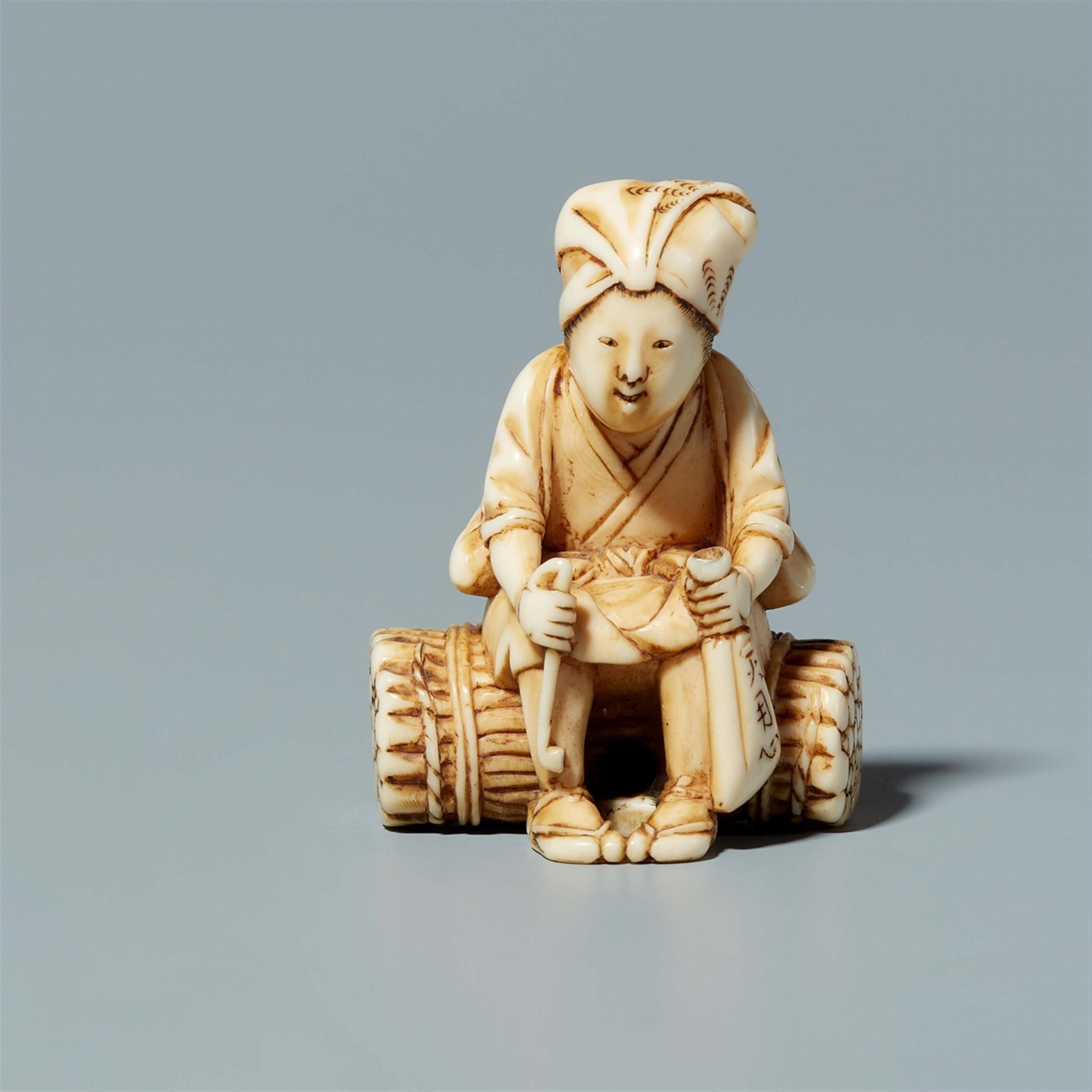 An ivory netsuke of a farmer, by Tomochika. Mid-19th century - image-1