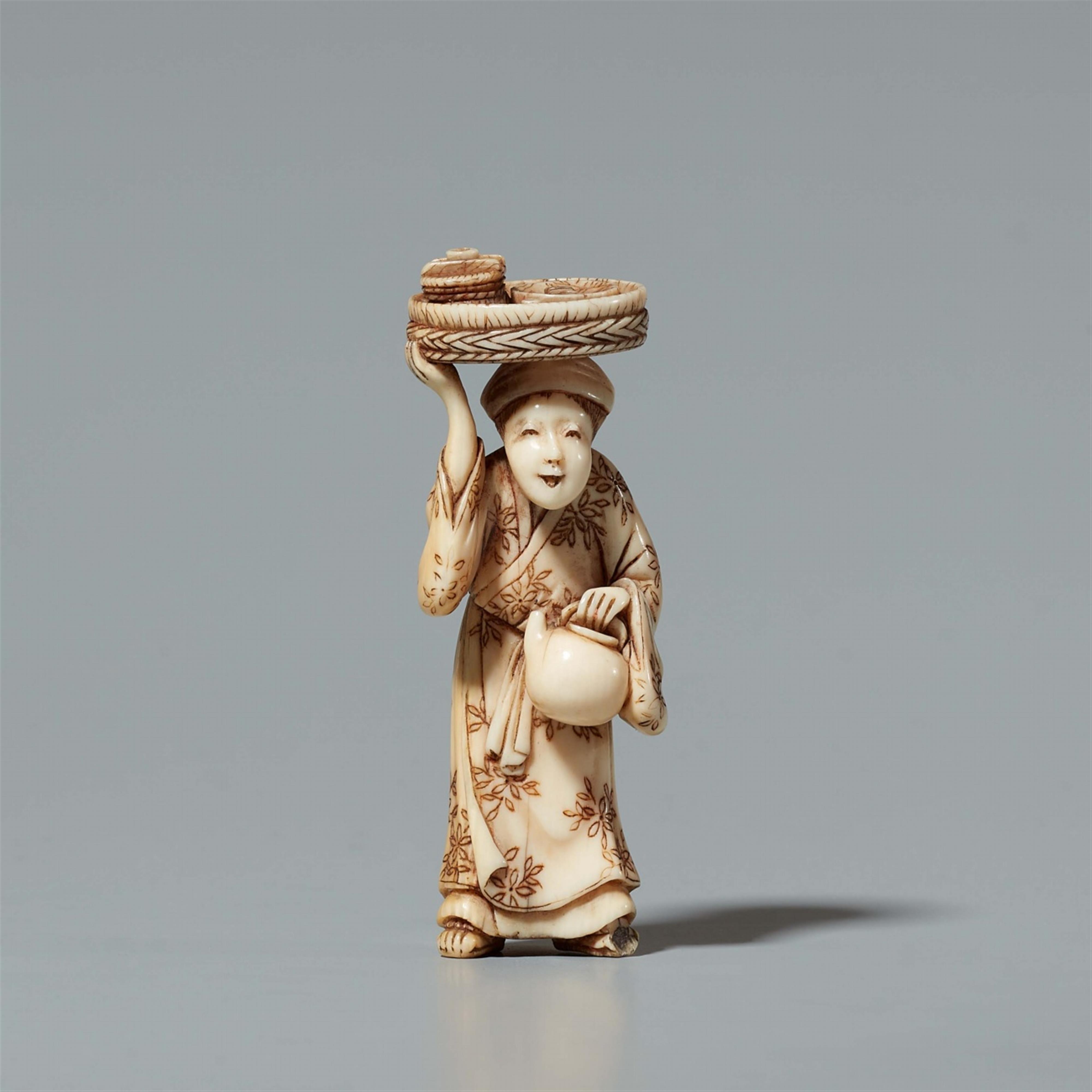 An ivory netsuke of an elderly servant. Mid-19th century - image-1