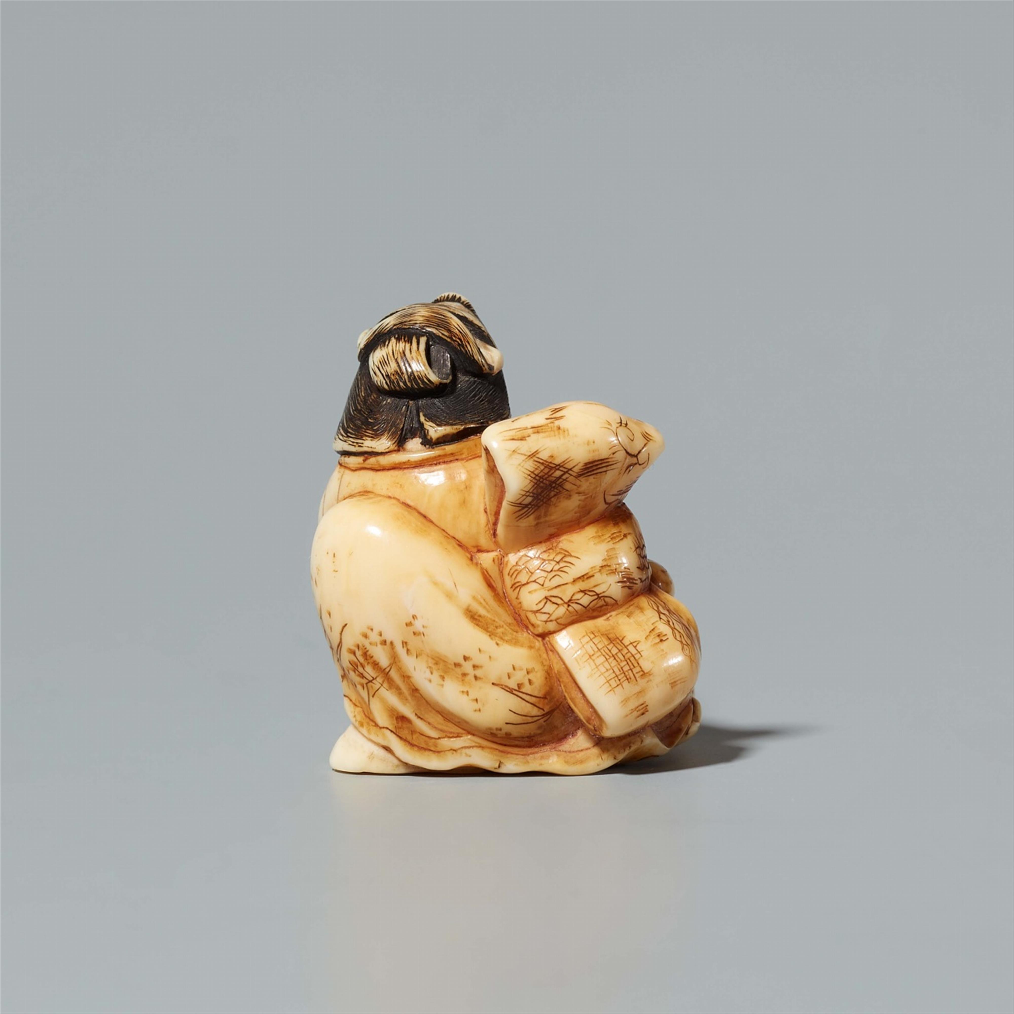 An ivory netsuke of a geisha seated on a tengu mask. 19th century - image-3