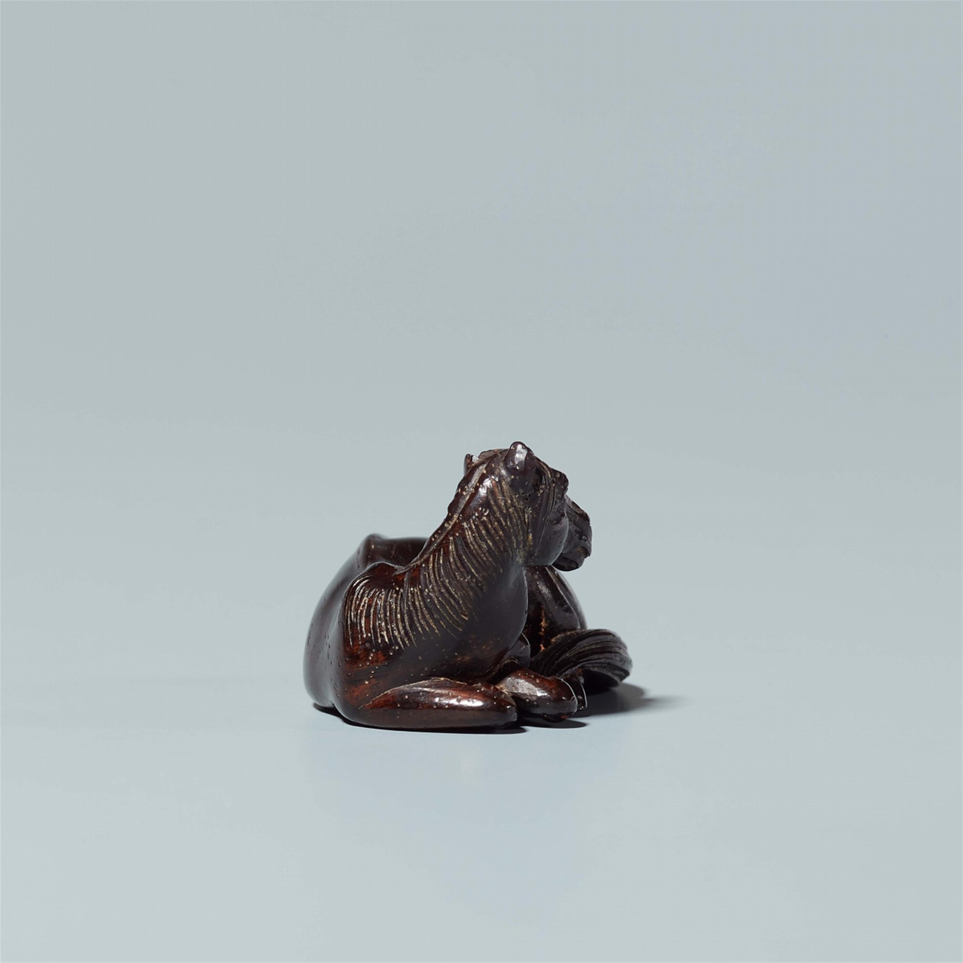 A tagayasan wood netsuke of a reclining horse. Probably last third 19th century - image-4