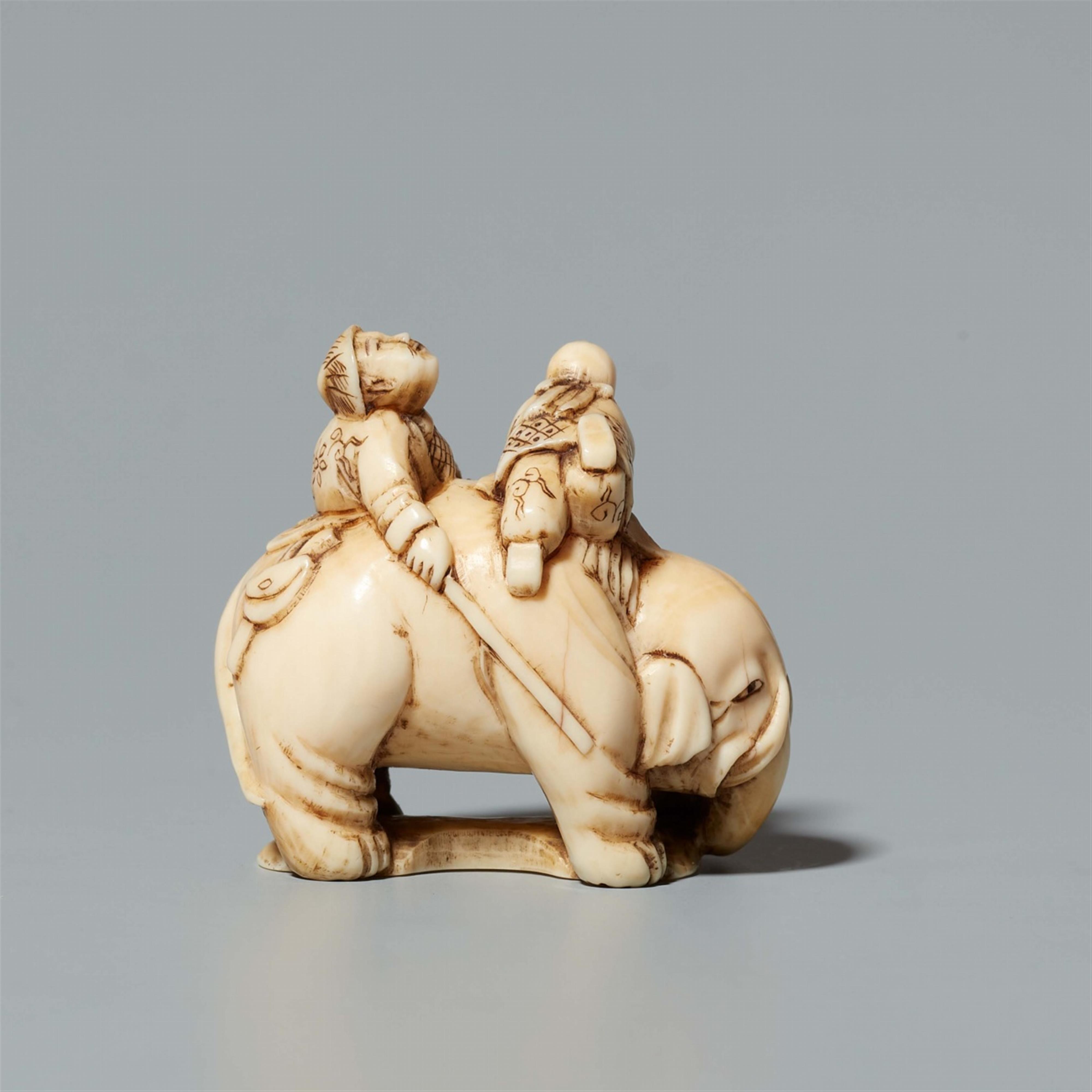 An ivory okimono netsuke of an elephant and boys. Late 19th century - image-2