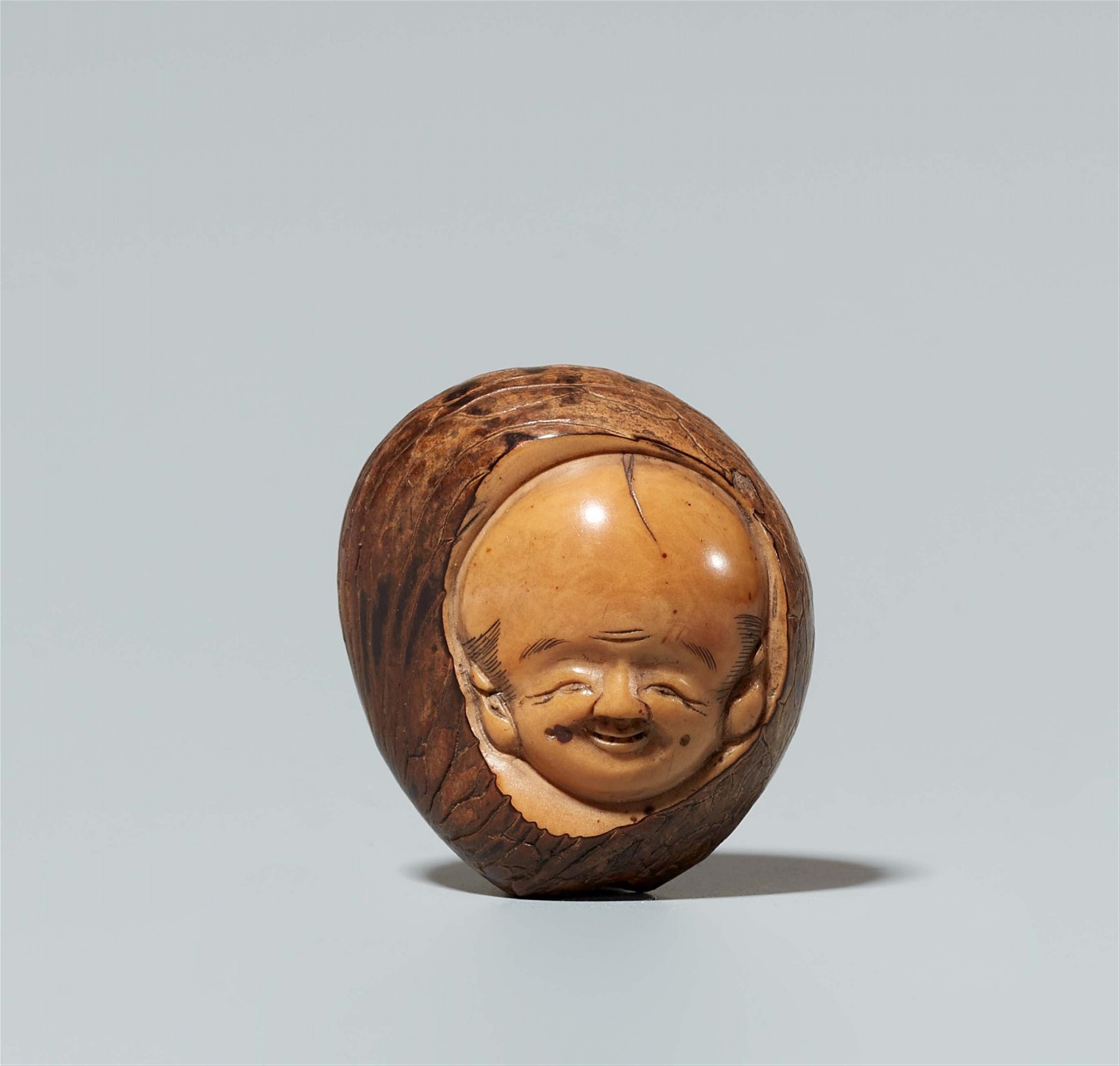 A corozo nut netsuke of Fukusuke, by Masaharu. Late 19th century - image-1