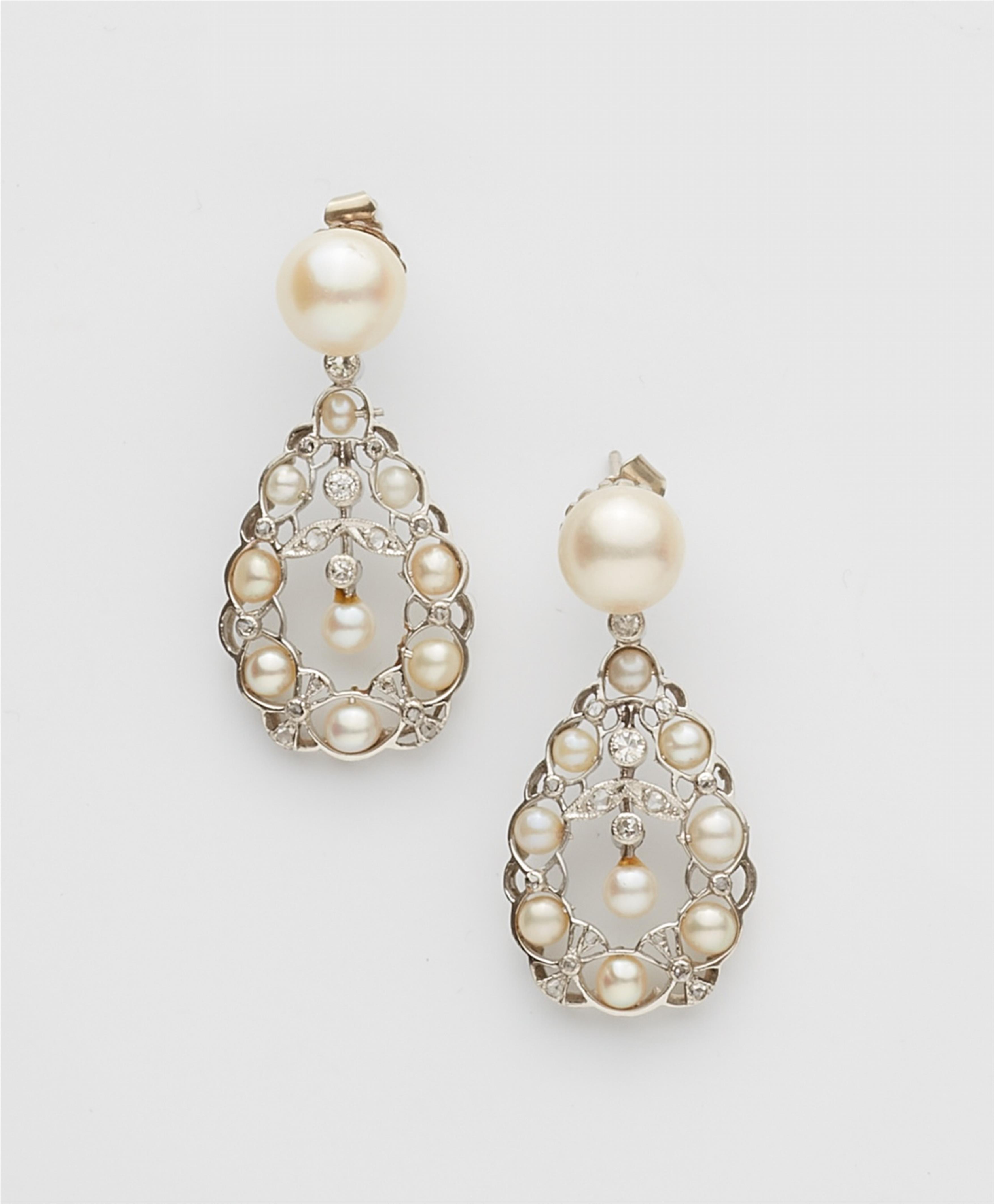 A pair of Belle Epoque platinum diamond and pearl earrings - image-1