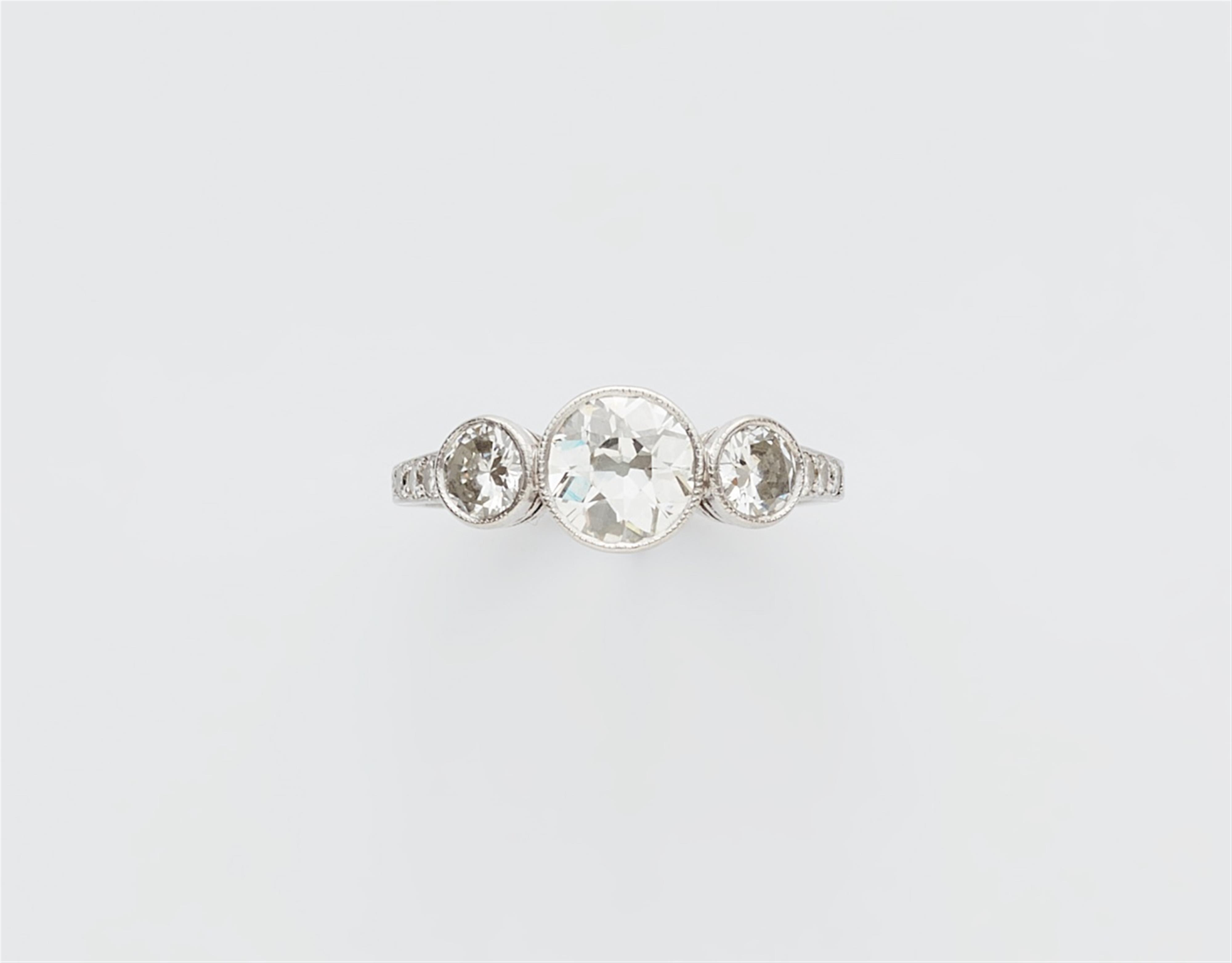 A platinum three-stone diamond ring - image-1