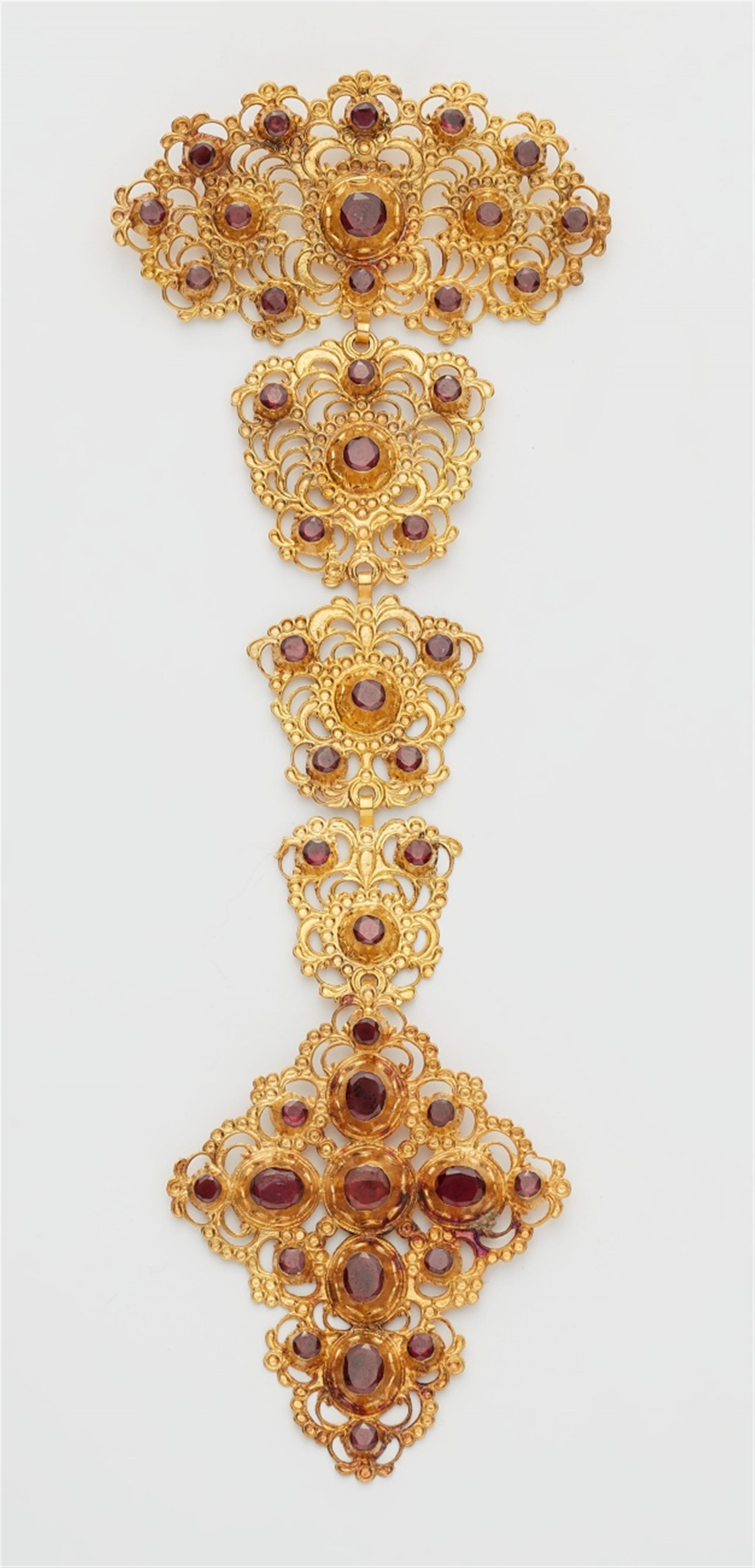 A large gold garnet corsage ornament - image-1