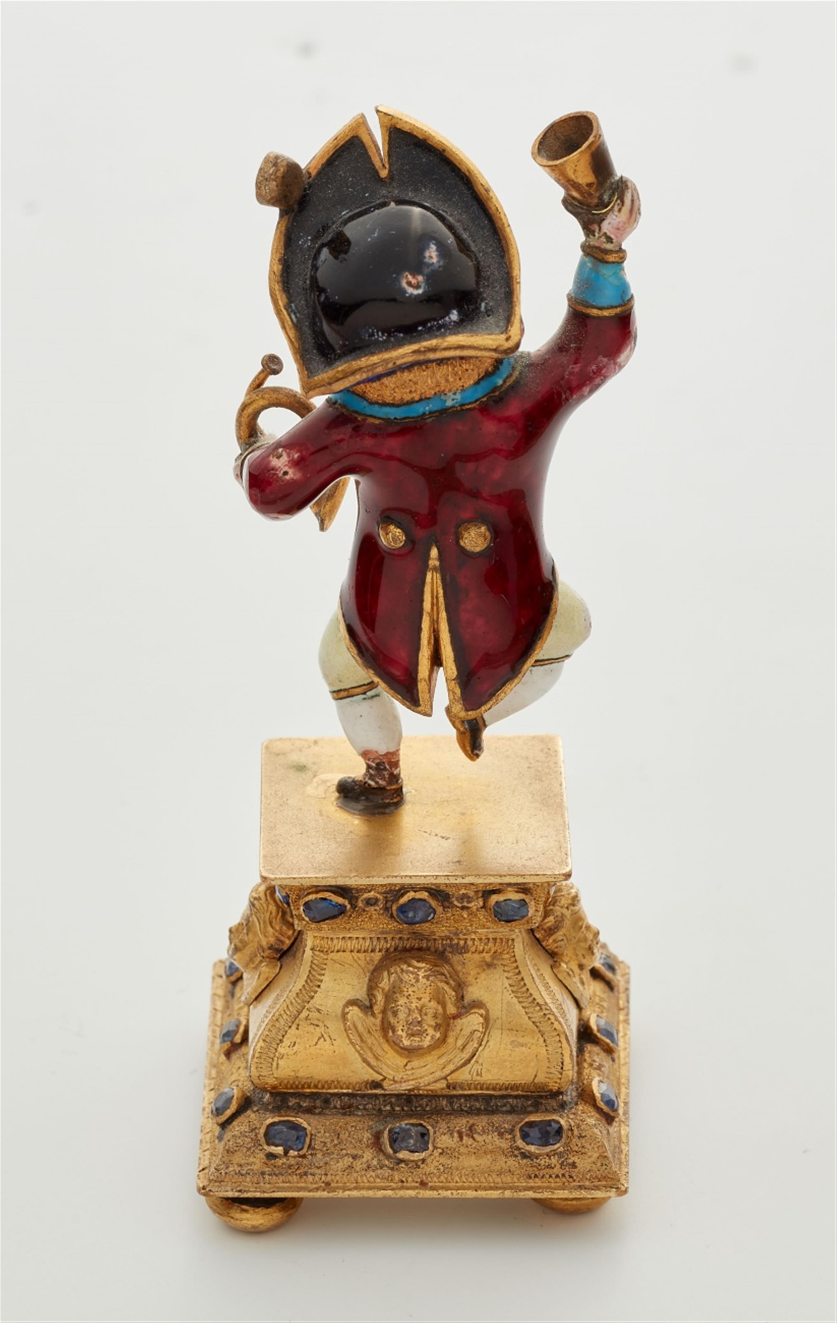 A miniature gold statuette of a drinking dwarf - image-2