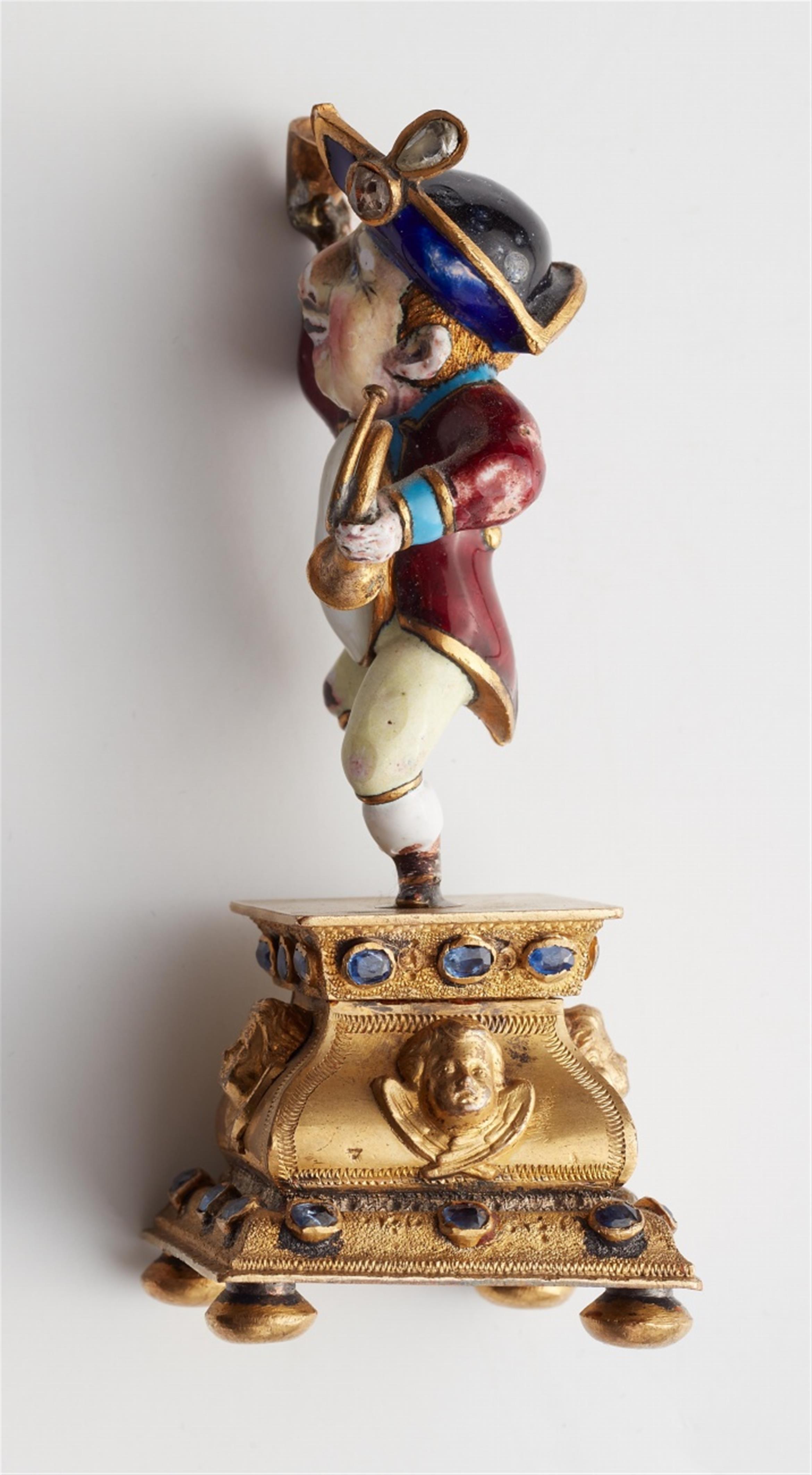 A miniature gold statuette of a drinking dwarf - image-3