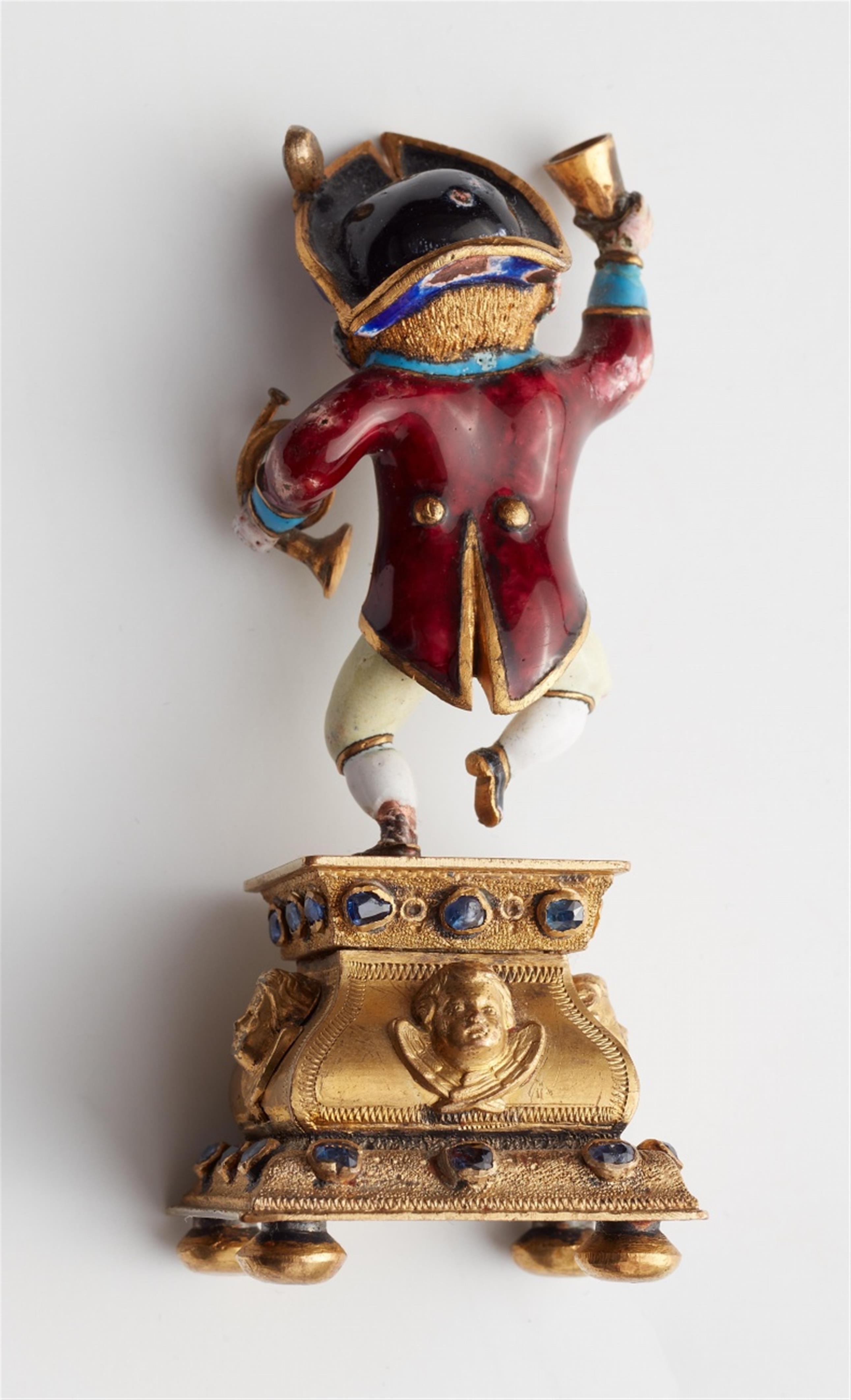 A miniature gold statuette of a drinking dwarf - image-5