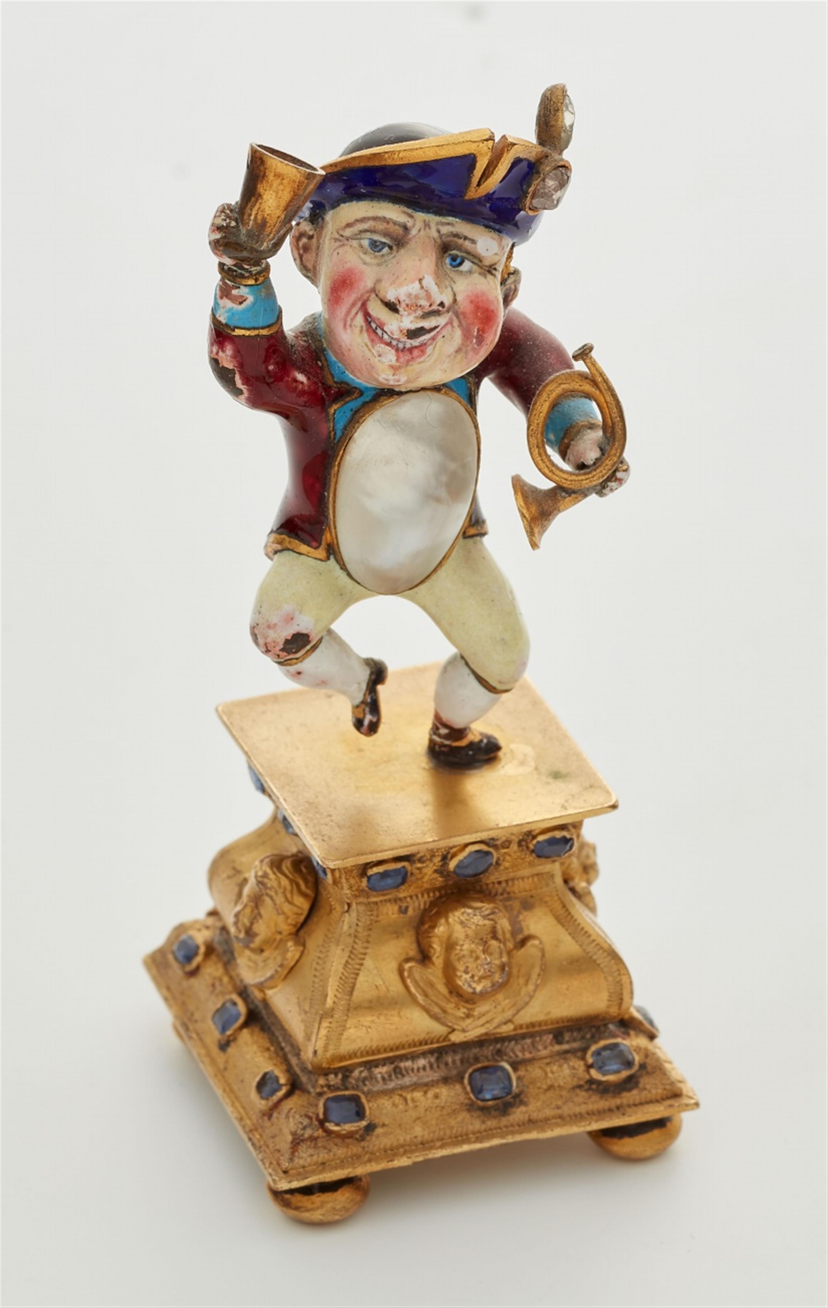 A miniature gold statuette of a drinking dwarf - image-1