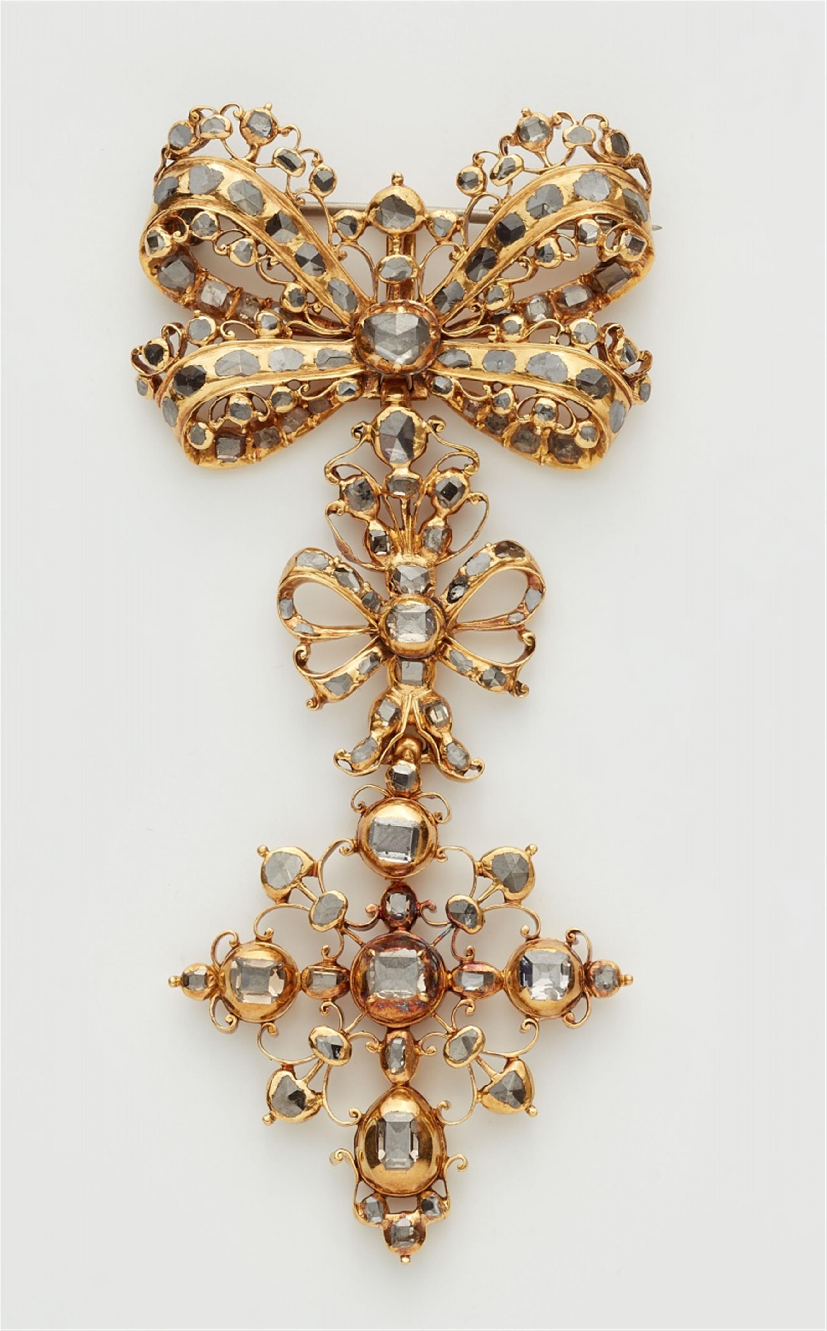 A gold diamond pendant brooch - image-1