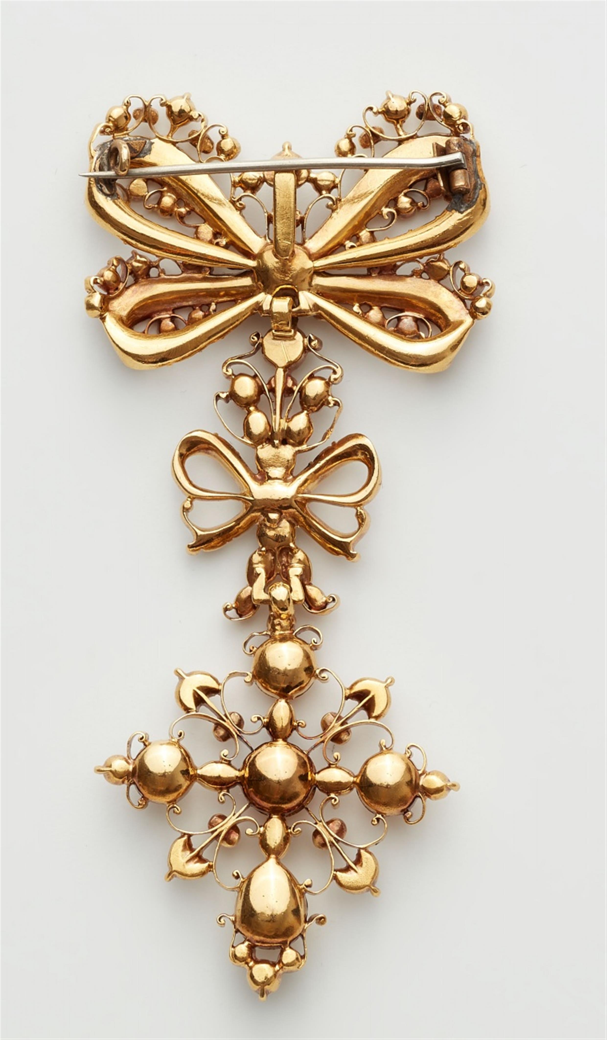 A gold diamond pendant brooch - image-2